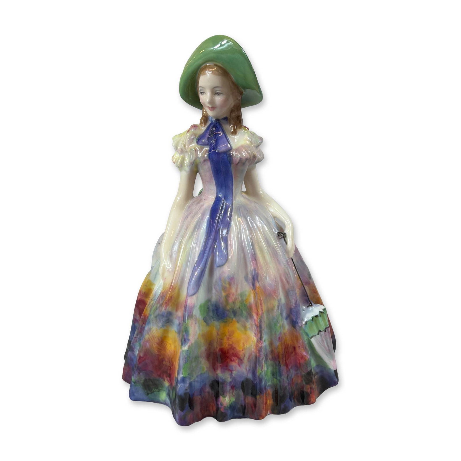 Royal Doulton Easter Day Porcelain Figurine HN 2039: Royal Doulton glazed bone china figurine titled Easter Day, model number HN 2039. The figure depicts a standing woman in a Victorian-style dress decorated with a multicolored watercolor-style floral p