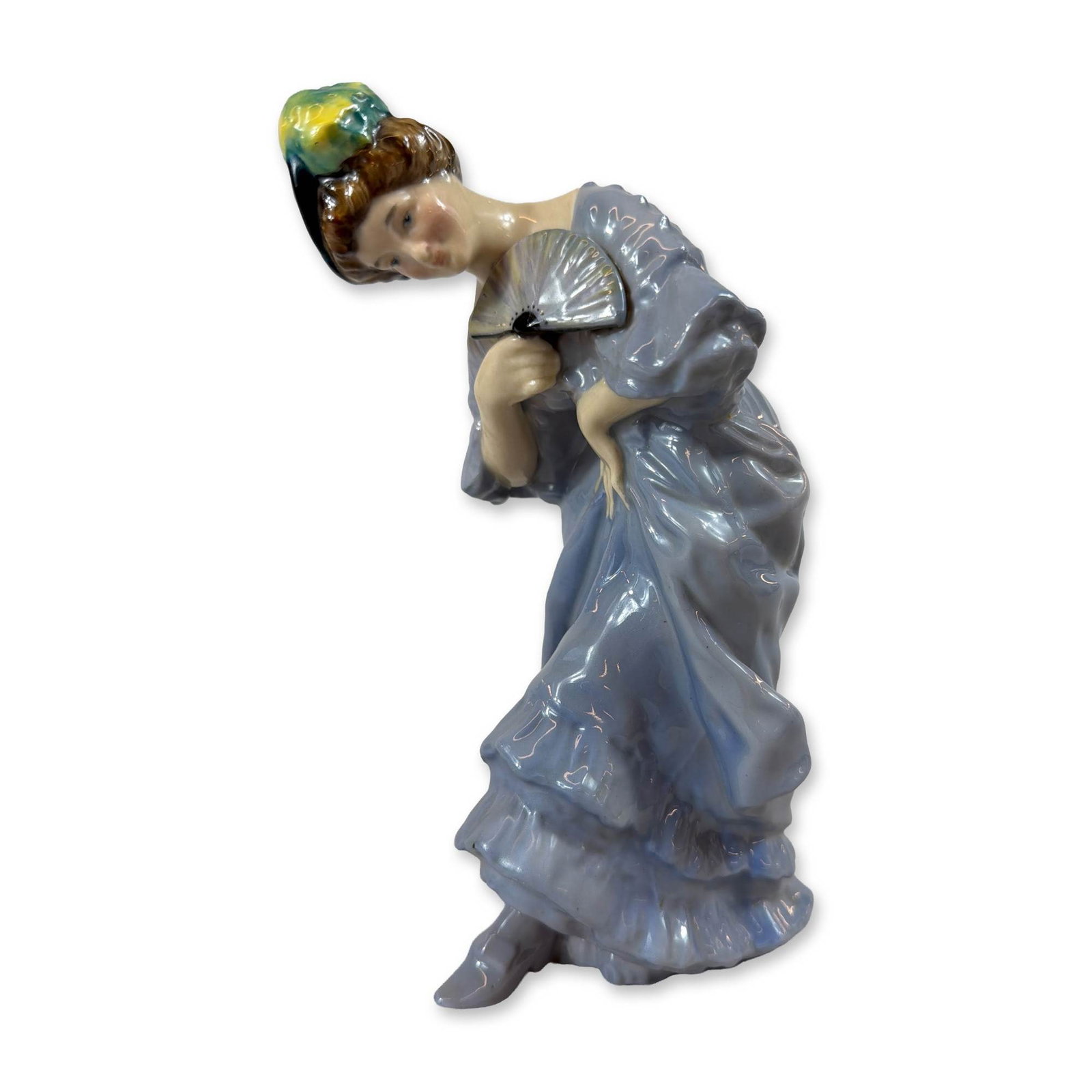 Royal Doulton Lady with Fan Porcelain Figurine HN 84: Royal Doulton glazed porcelain figurine titled Lady with Fan, model HN 48, designed by Ernest W. Light. The figure depicts a standing young woman in a lavender-blue ruffled gown, looking over her shou