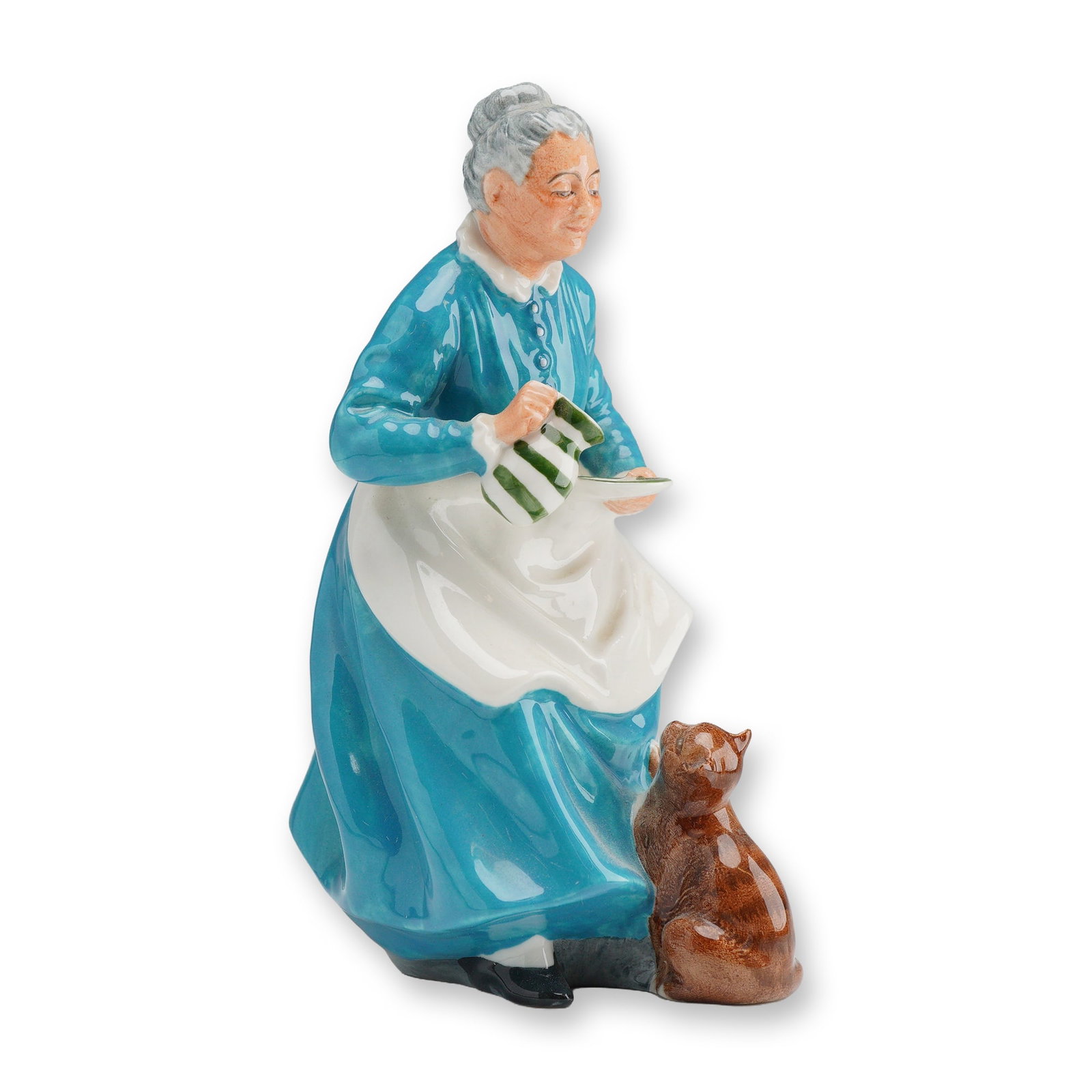 Royal Doulton Figurine, The Favorite HN2249: The hand-painted piece depicts an elderly woman with gray hair swept into a bun, dressed in a vibrant turquoise-blue gown with a white collar and a white apron tied with a bow. She is captured in the 