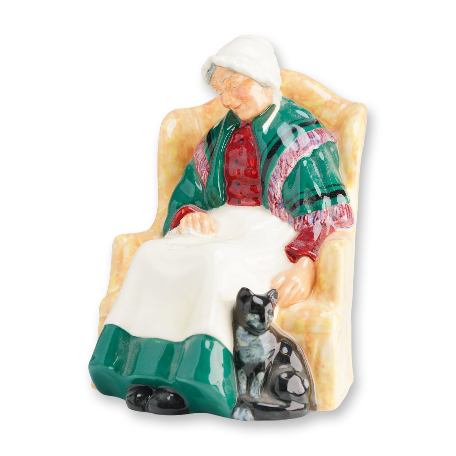 Royal Doulton Forty Winks HN 1974 Ceramic Figurine: A Royal Doulton Figurine, Forty Winks HN1974, depicting an elderly woman in a yellow armchair with a black cat, primarily colored white, green, and red, marked MADE IN ROYAL DOULTON ENGLAND and COPR 1