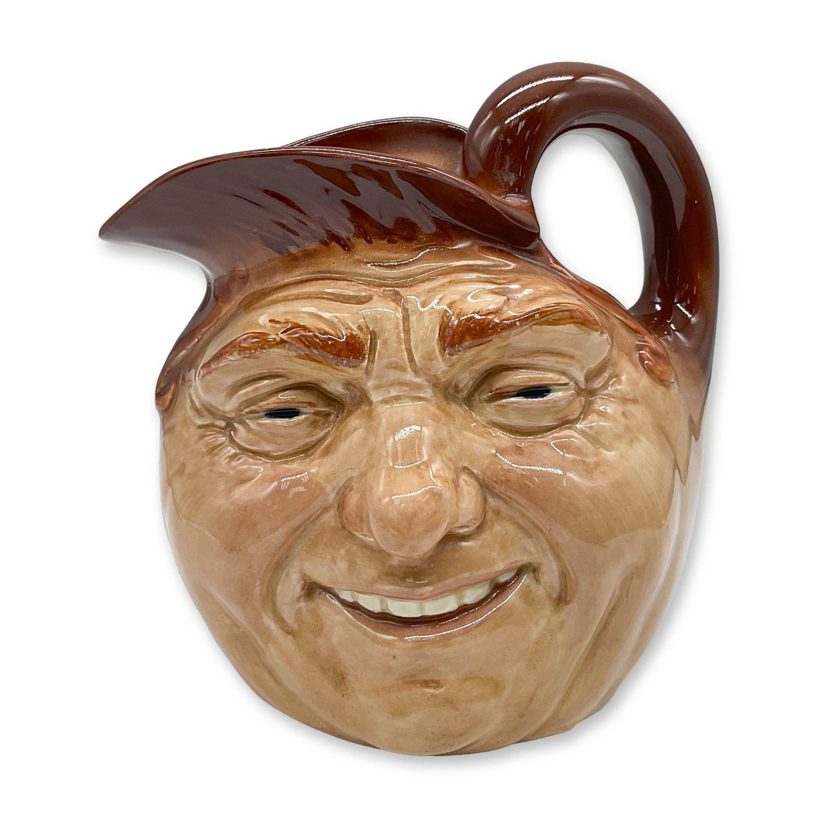 John Barleycorn D5327 - Large - Royal Doulton Character Jug: Inside Handle, brown rim with light brown body. This character jug was the first design created by Charles J. Noke in 1934. Royal Doulton backstamp. Artist: Charles J. Noke Dimensions: 7"L x 4.75"W x 