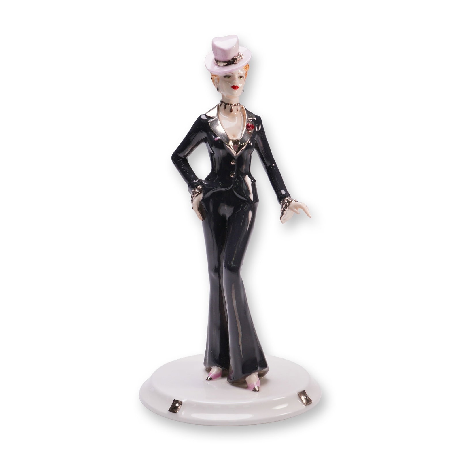 Coalport Bone China Figurine, Something In The City: Limited edition Bone China from the David Shilling Celebration Collection. Depicts a poised female figure dressed in a glossy black tailored pantsuit with flared trousers and a fitted jacket accented 