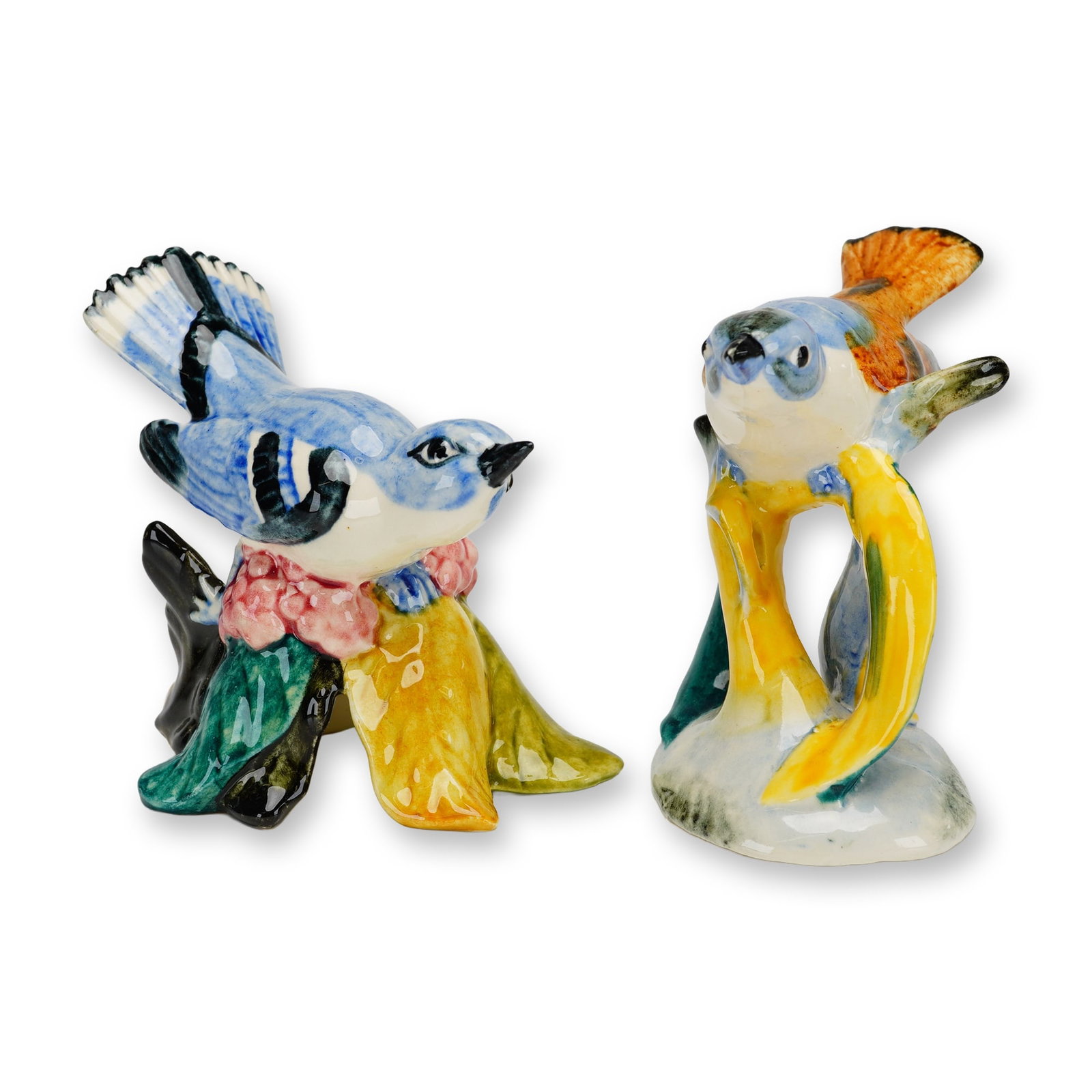 Two Stangl Pottery Bird Figurines, Blue Headed and Cerulean Warbler: The figurines are identified as a Blue Headed Vireo, model number 3448, and a Cerulean Warbler blue bird, model number 3456. Each figurine is hand-painted with multi-colored glazes and marked on the u