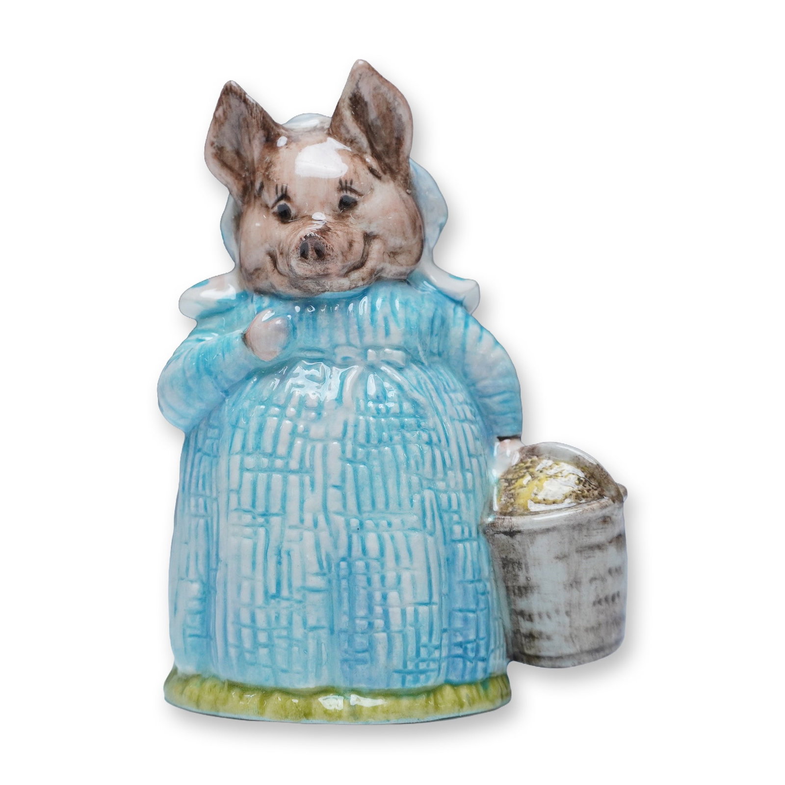 Royal Albert Beatrix Potter Figurine, Aunt Pettitoes: This Royal Albert figurine brings to life Aunt Pettitoes, the endearing pig character from Beatrix Potter's classic tales. Dressed in a textured blue gown with a matching bonnet, she holds a bucket, r