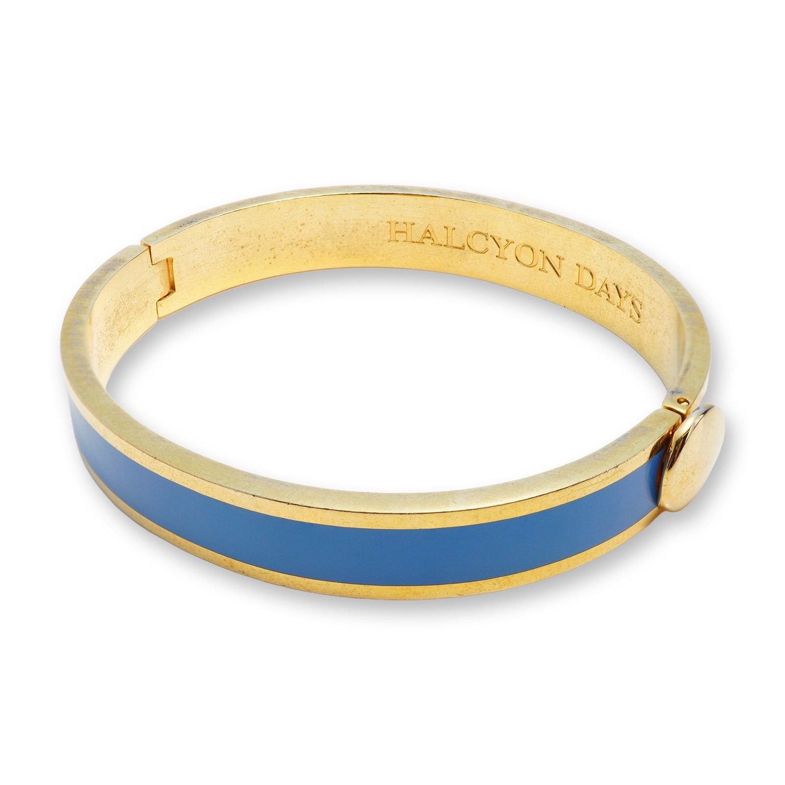 Halcyon Days Gold-Plated Blue Enamel Hinged Bangle Bracelet: This 18K gold-plated metal hinged bangle is a classic design by Halcyon Days. The piece features a central band of smooth, royal blue enamel inlay set within a polished gold-plated frame. The interior