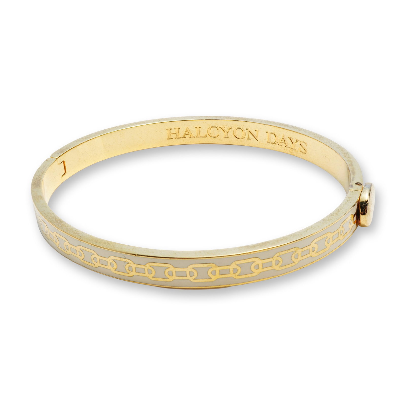 Halcyon Days Gold-Plated Cream Enamel Skinny Chain Motif Hinged Bangle: This hinged bangle bracelet by Halcyon Days is crafted from 18K yellow gold-plated base metal featuring a sophisticated cream enamel inlay. The exterior is decorated with a continuous, repeating gold-