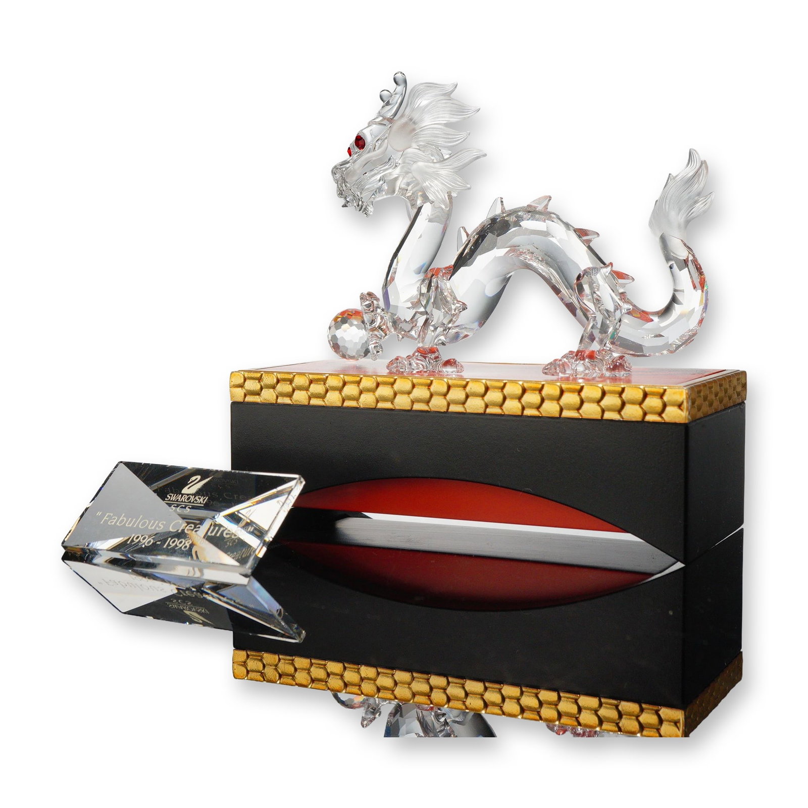 Swarovski SCS 1997 Crystal Dragon Figurine: Swarovski Crystal Society (SCS) 1997 Annual Edition crystal figurine titled The Dragon, designed by Gabriele Stamey as the second release in the Fabulous Creatures trilogy. The Chinese style dragon is