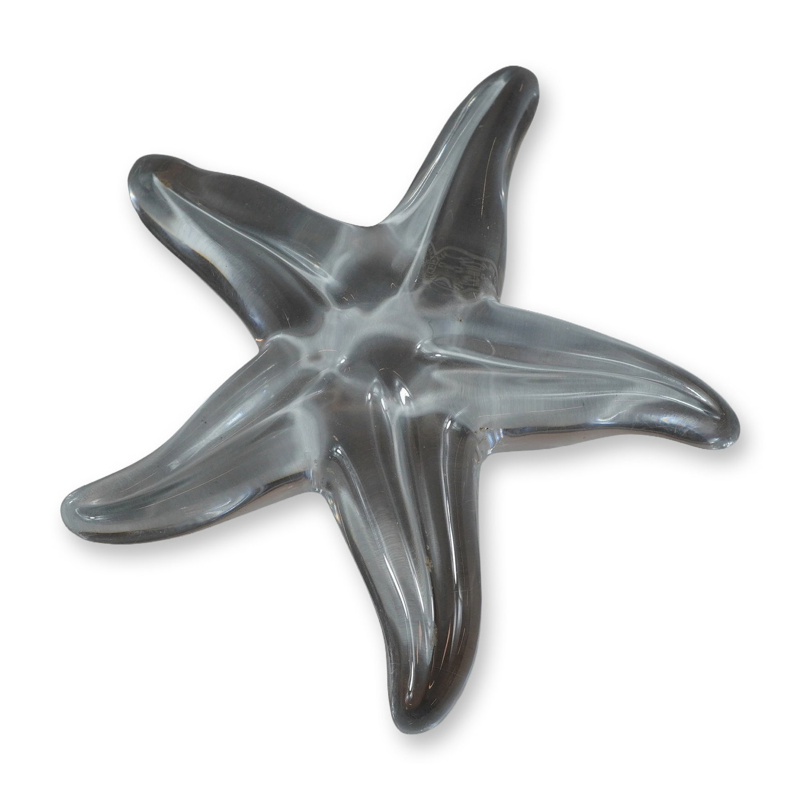 Baccarat Clear Crystal Starfish Figurine: Baccarat clear crystal starfish paperweight figurine. This solid lead crystal decorative piece is formed as a stylized five-point sea star with smooth, polished contours and a clear, light-catching fi