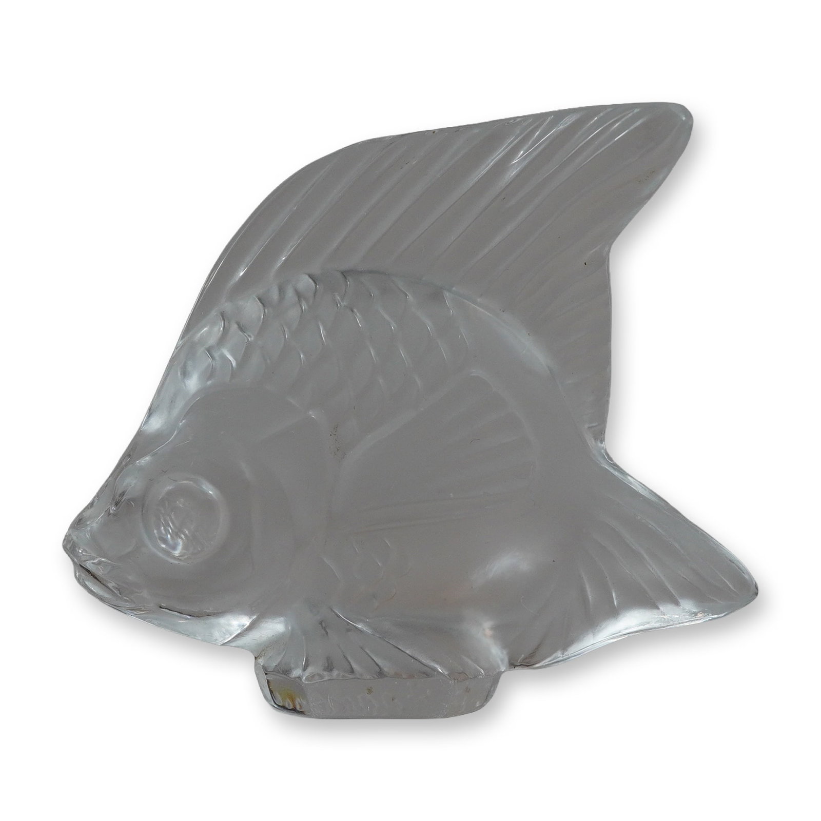 Lalique Clear Crystal Fish Figurine: Lalique France clear crystal fish figurine, modeled in the classic Poisson pattern originally designed by Rene Lalique in 1913. The stylized figure features alternating frosted and polished surfaces t
