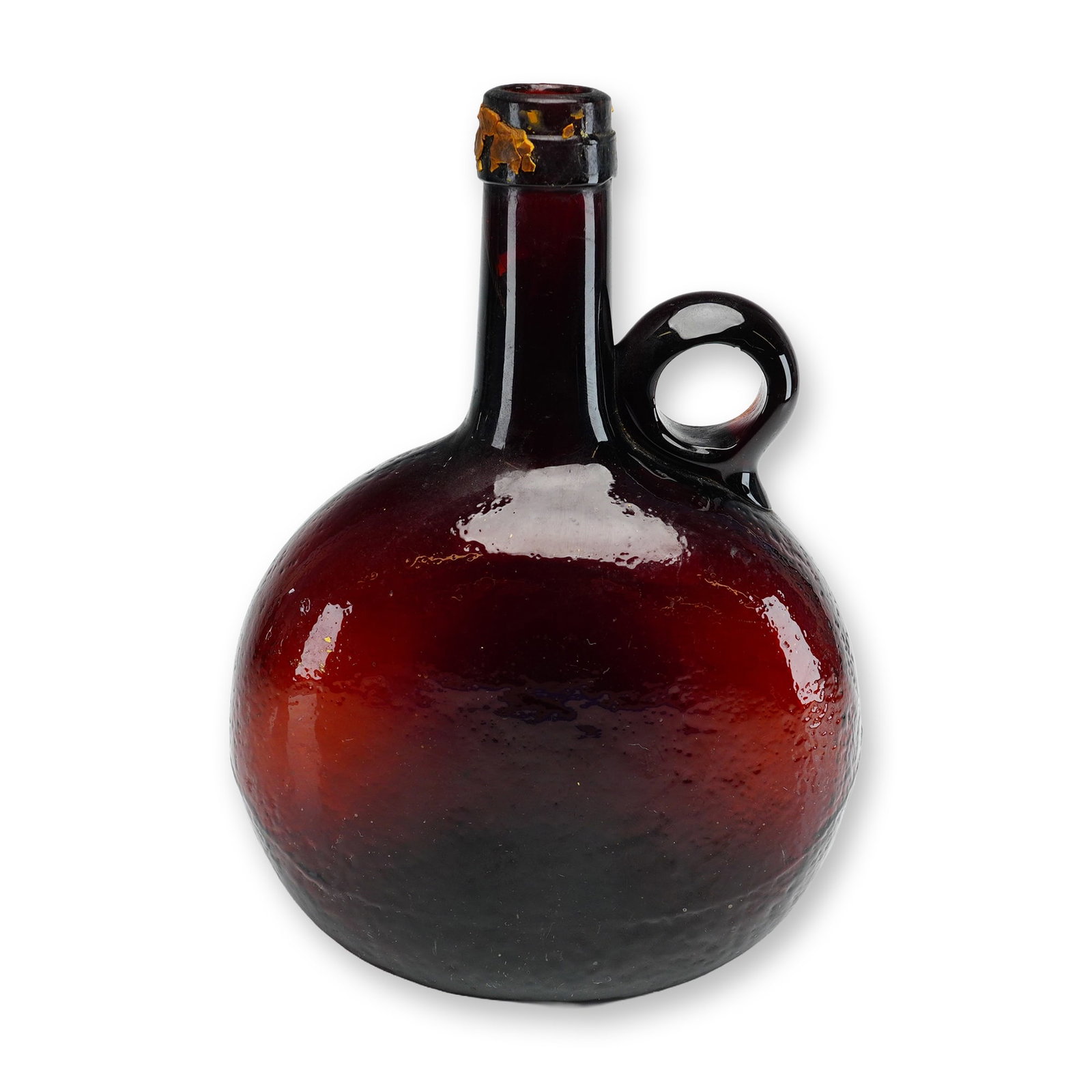Antique Reddish Amber Blown Chestnut Glass Flask: This 19th-century hand-blown glass vessel is a chestnut-shaped bottle or flask, frequently utilized as a whiskey bottle or decanter. The piece is crafted from deep reddish amber glass, which displays 