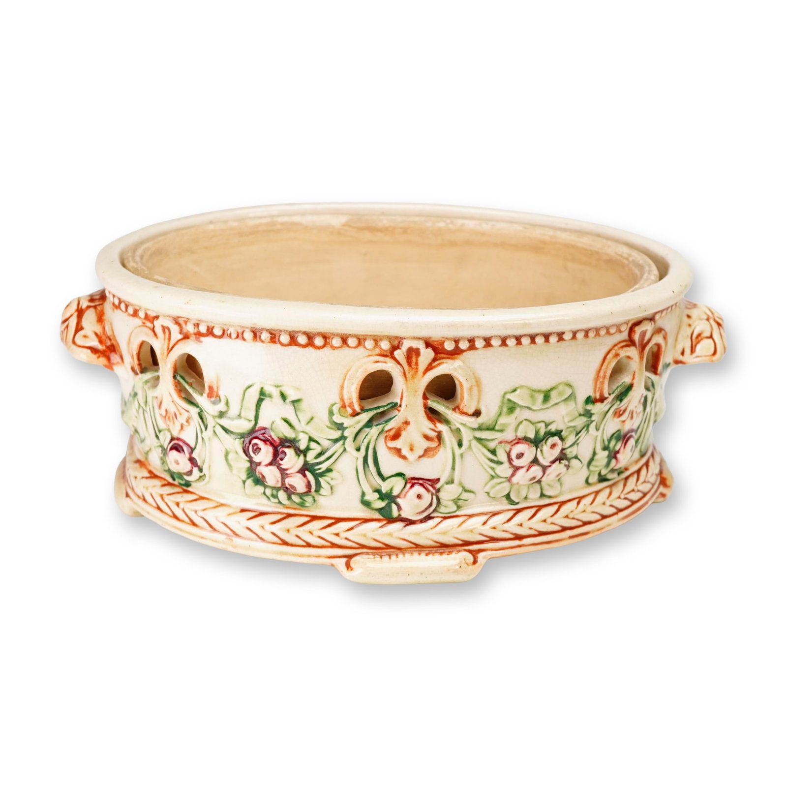 Weller Pottery Jardiniere with Liner, Roma Rose Garland: This early 20th-century American art pottery jardiniere was produced by Weller Pottery in the Roma pattern, circa 1910-1920. The two-part set includes an oval outer vessel and a removable ceramic line