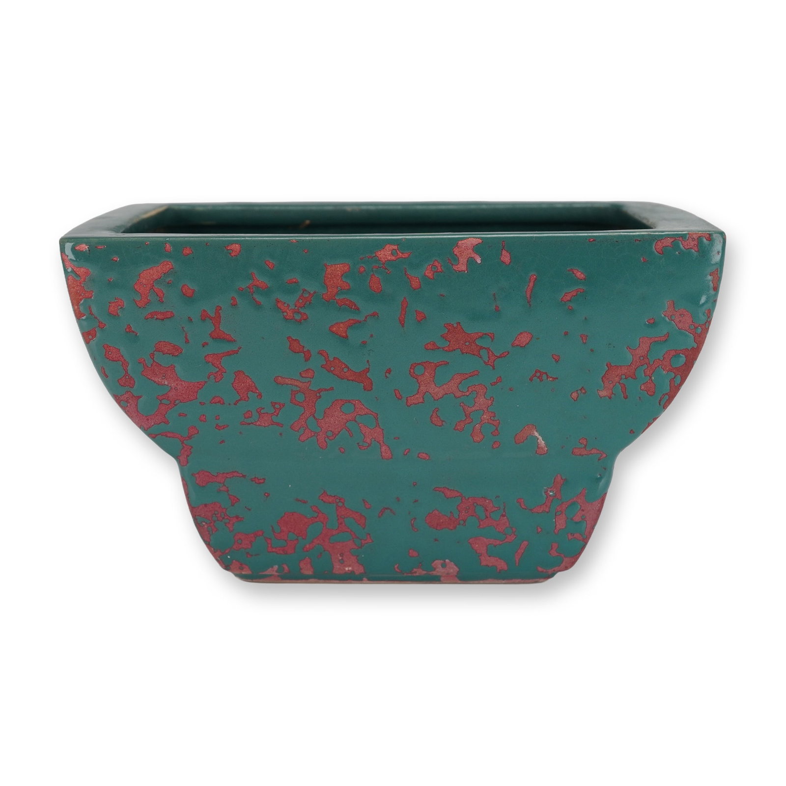 McCoy Brocade Green and Pink Ceramic Planter: A single ceramic planter, McCoy Pottery, featuring the distinctive Brocade pattern. This piece is characteristic of mid-century design, presenting a flared, square-to-rectangular profile. The earthenw