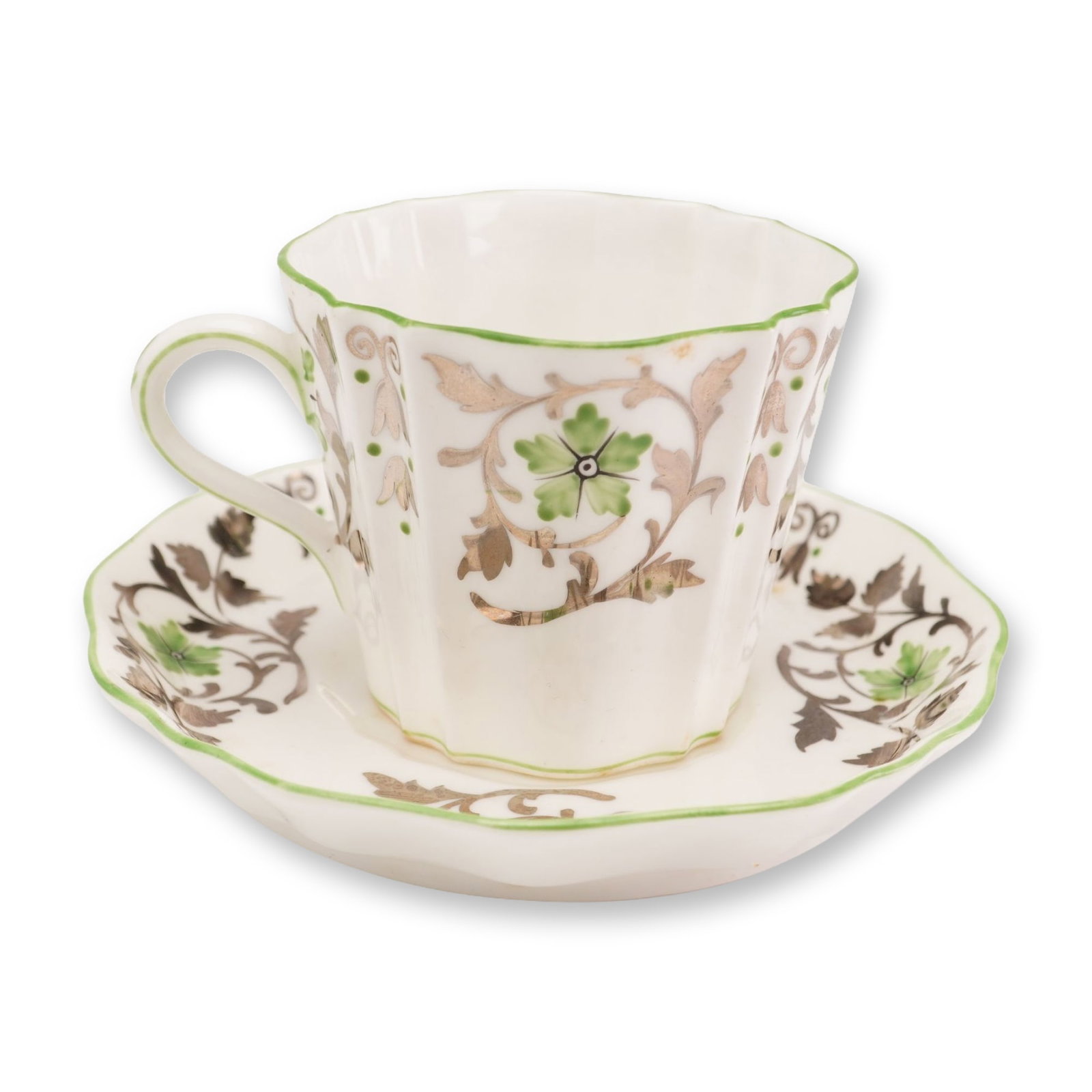 Wedgwood Bone China Teacup and Saucer, 1930: This Wedgwood fine bone china teacup and saucer set features a fluted, lobed form with scalloped rims. The decoration is composed of hand-colored transfer-printed elements, specifically a central five