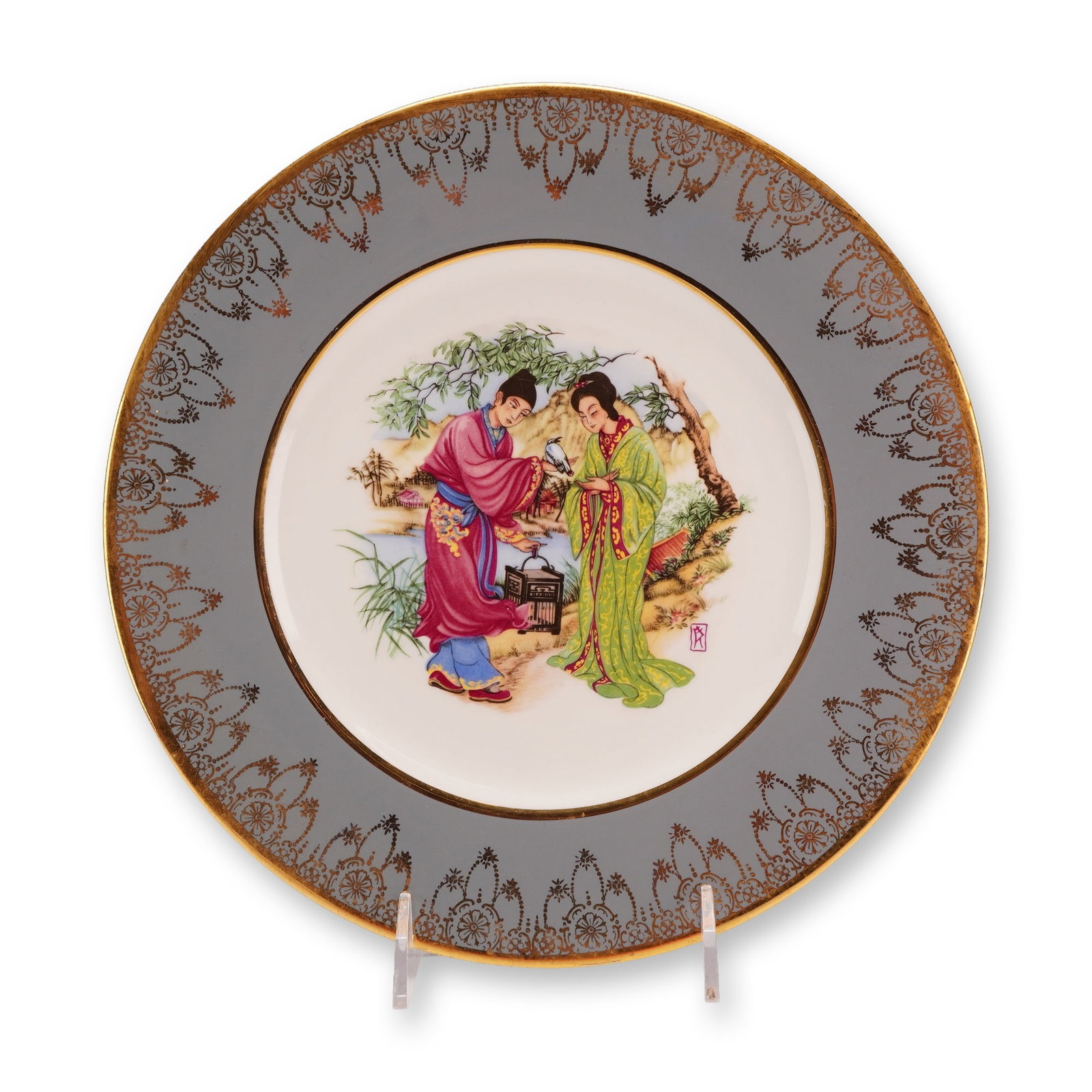 Wedgwood Bone China Chinoiserie Decorated Plate: This bone china plate, manufactured by Wedgwood, features a central polychrome enamel scene in the Chinoiserie style. The decoration depicts two figures in traditional Chinese attire within a landscap