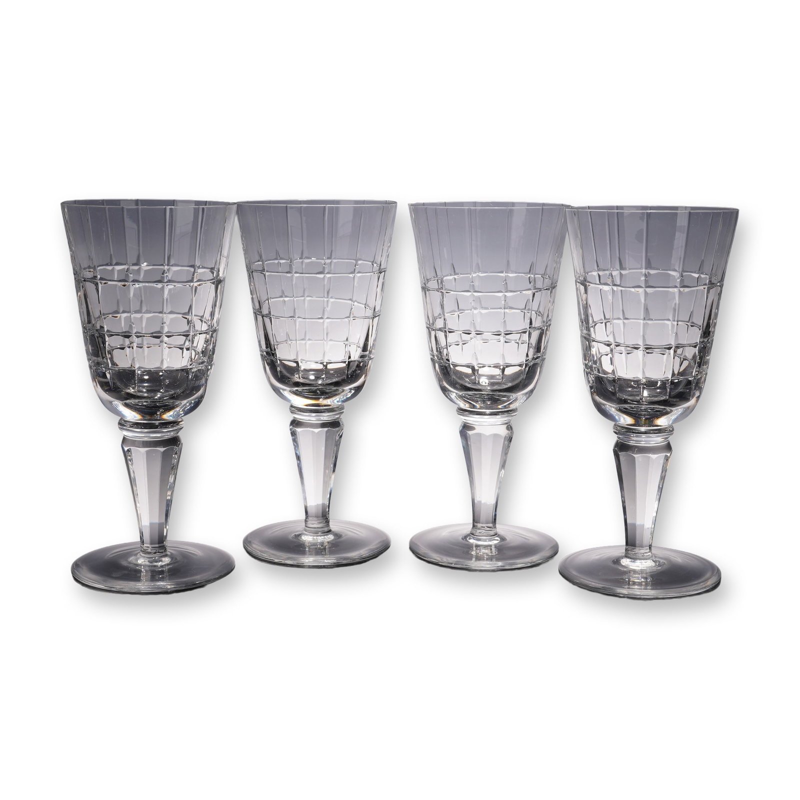 4pc Crystal Wine Glasses with Geometric Cut Pattern: A refined set of four crystal wine glasses featuring bold geometric cuts and faceted stems that sparkle brilliantly in the light. Their generous bowls and graceful design make them ideal for enjoying 