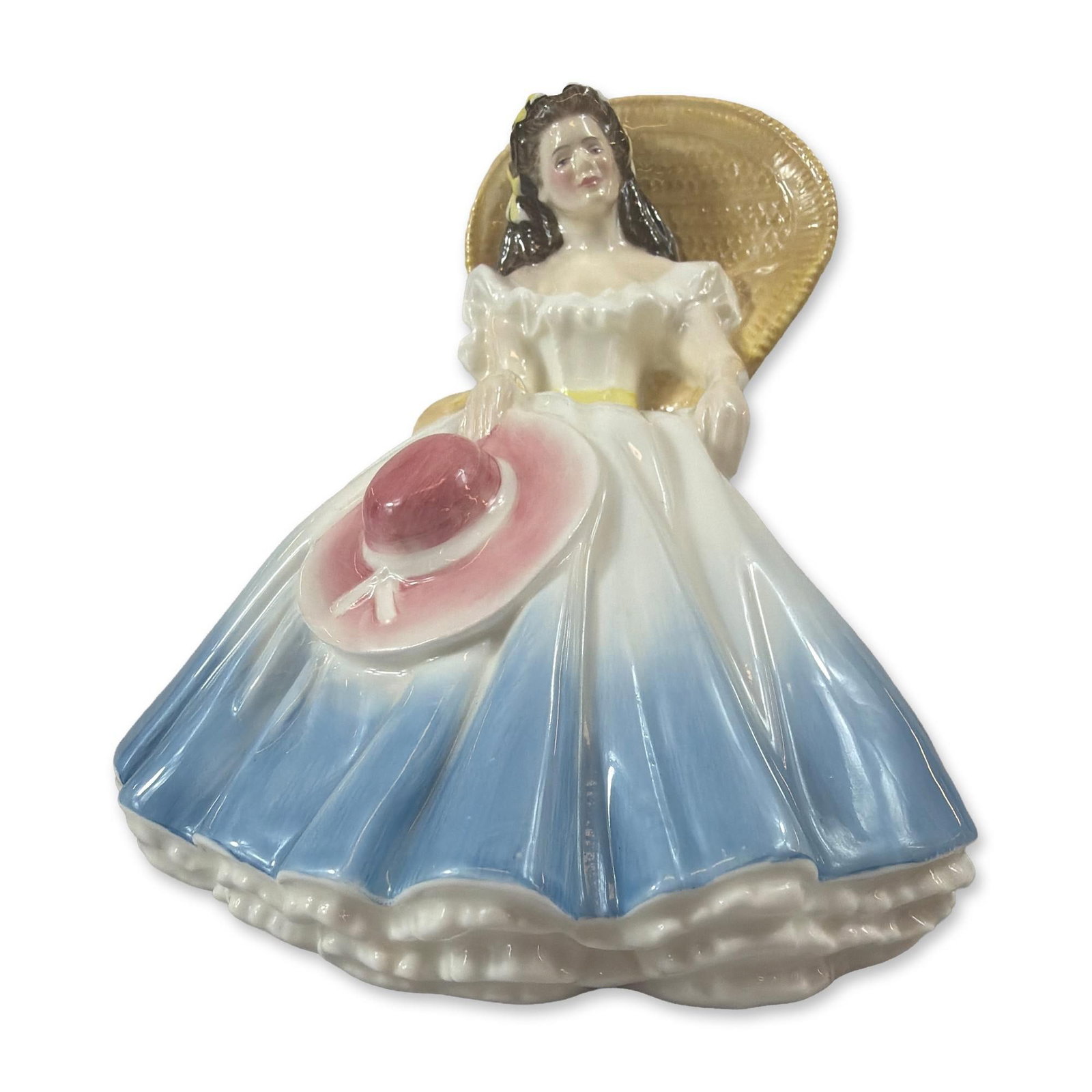 Royal Doulton Annabel Bone China Figurine HN3273: Royal Doulton bone china figurine titled Annabel, model HN 3273, modeled by Robert J. Tabbenor. The glazed ceramic figure depicts a seated young woman reclining against a yellow woven wicker-style bas