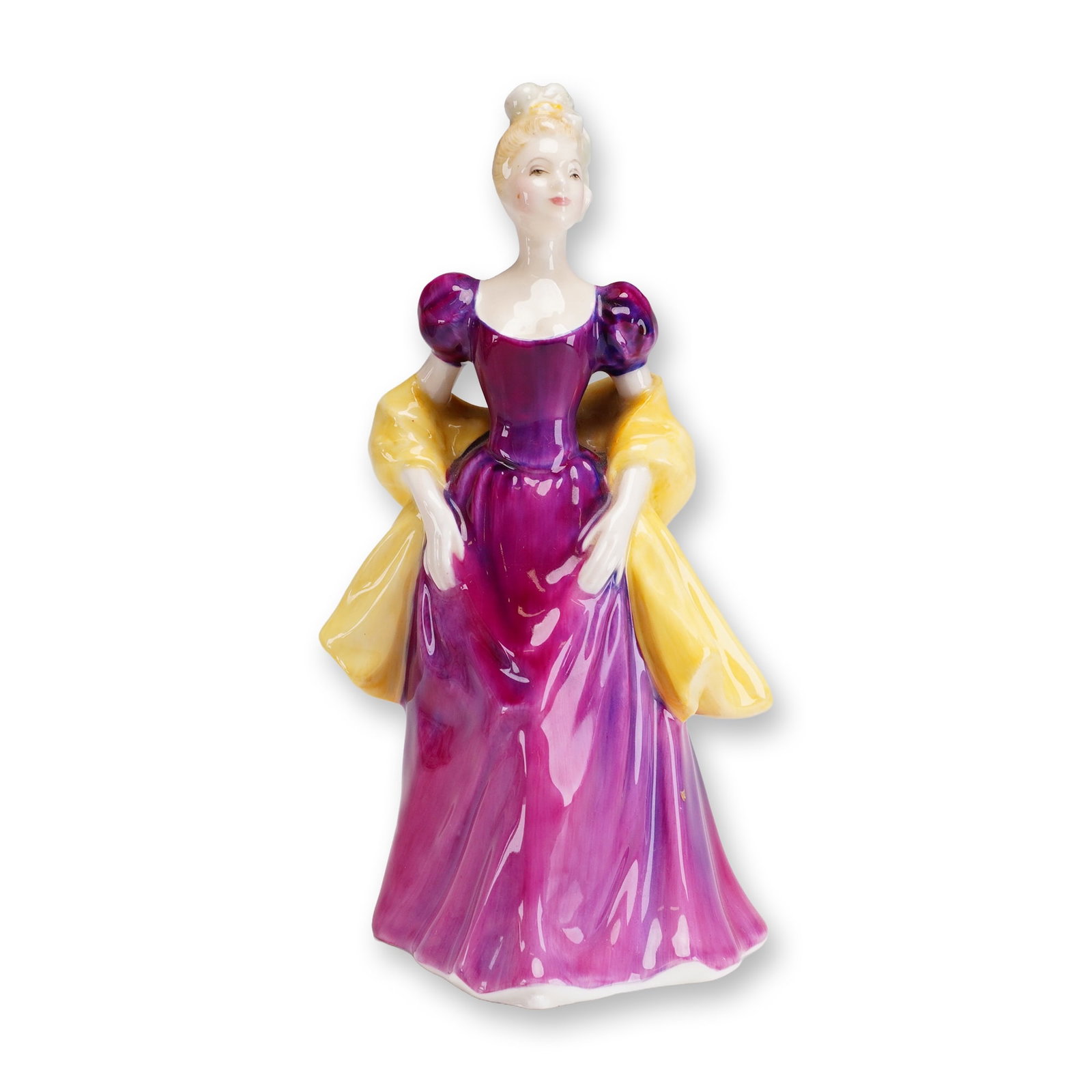Royal Doulton Figurine, Loretta HN2337: This hand-painted bone china figurine depicts a woman in elegant mid-20th-century attire, featuring a voluminous purple floor-length gown with a sweetheart neckline and a contrasting yellow shawl. Her