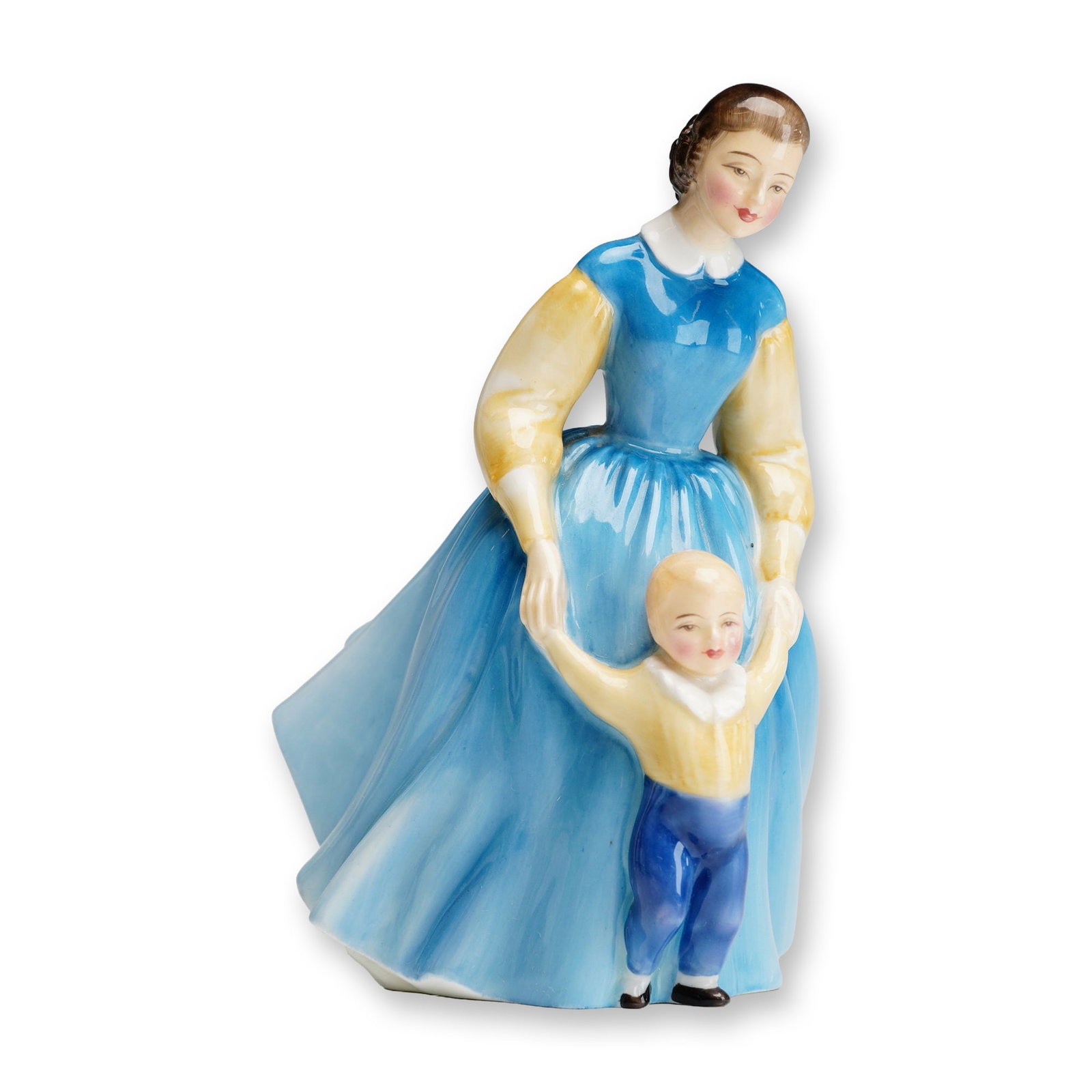 Royal Doulton, First Steps HN2242: A Royal Doulton glazed bone china figurine titled First Steps, model number HN2242. This polychrome piece depicts a young mother in a vibrant blue full-skirted gown with pale yellow puffed sleeves and