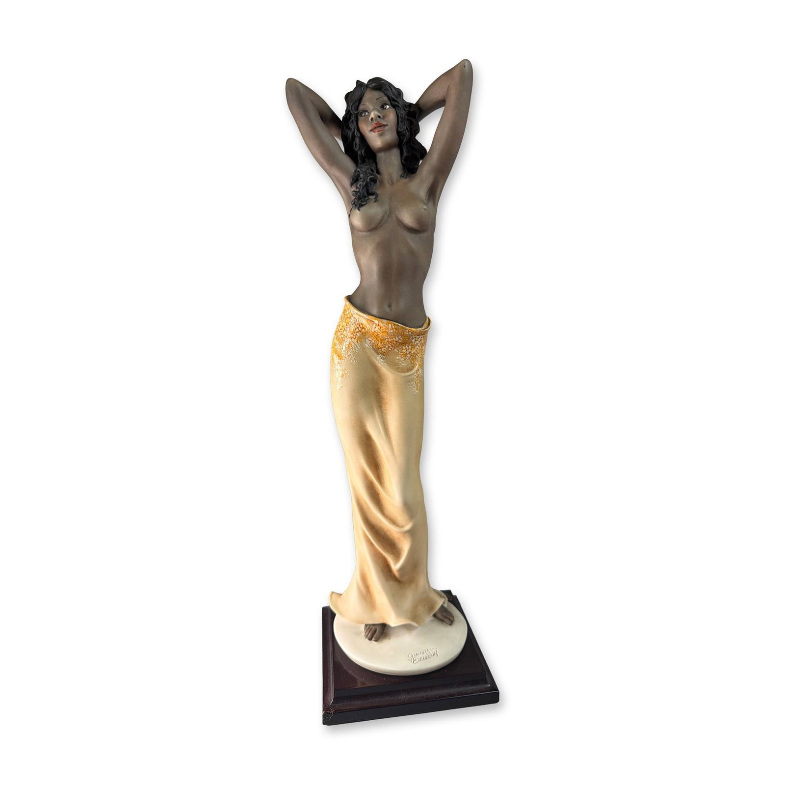 Giuseppe Armani Black Pearl Porcelain Figurine: Giuseppe Armani. Porcelain figurine titled Black Pearl, depicting a woman with dark skin in a flowing yellow skirt, bearing an incised signature, 2003 Florence stamp, and gold maker's label.Weight: 4 