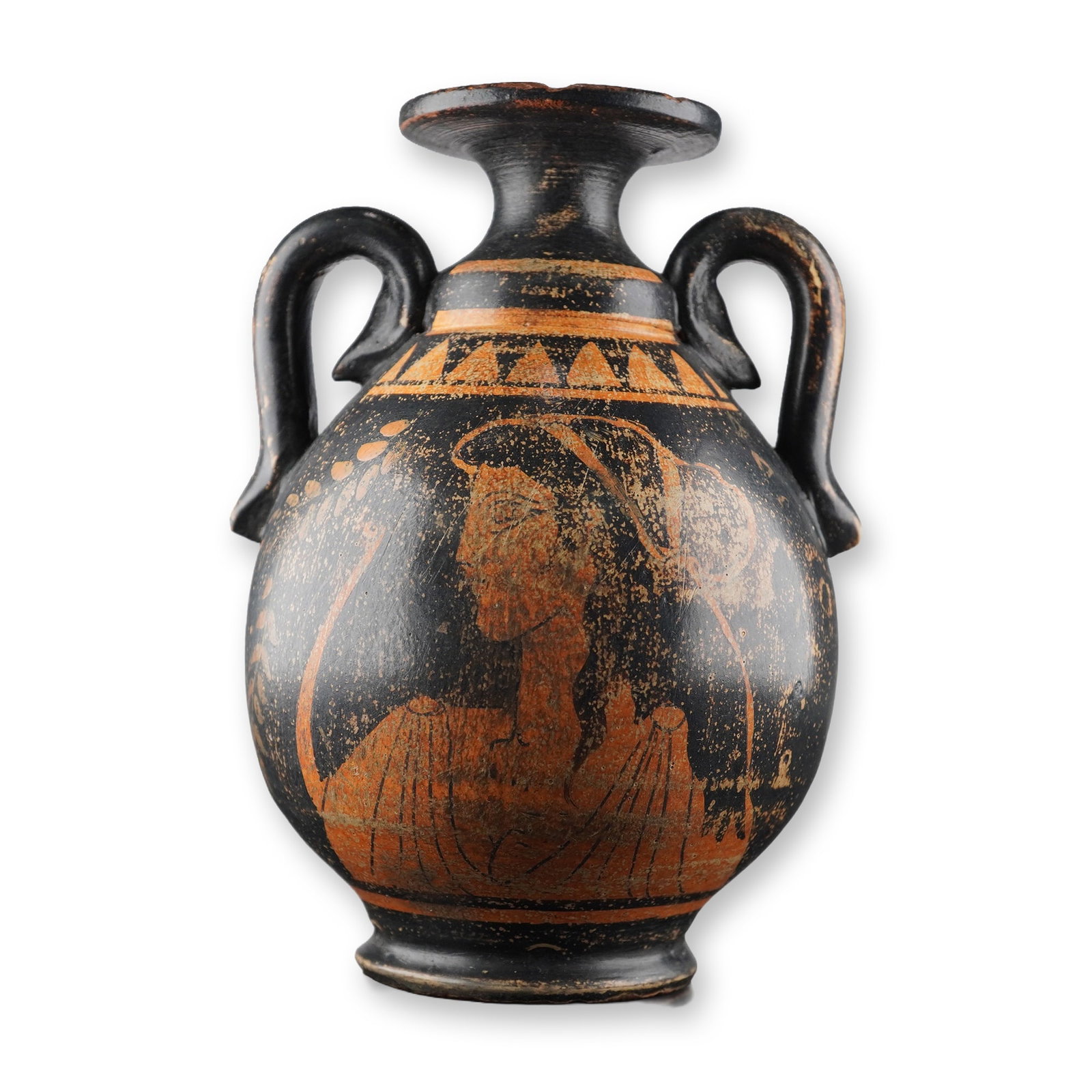 Grand Tour Period Greek Red Figure Pottery Vase: A small vase featuring a rounded body with twin handles, a flared lip, and decorated with red figure motifs against a black ground. One side depicts a female profile with detailed drapery and hair sty