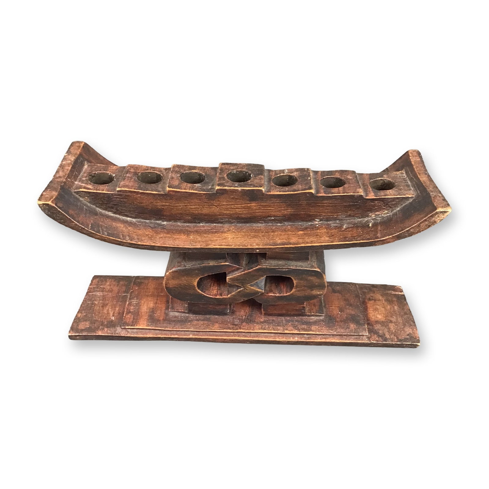 African Heritage Collection Hand Carved Wood Unity Kwanzaa Kinara: This hand-carved wooden kinara is part of the African Heritage Collection, identified as the Unity model. Produced in Ghana, the piece is constructed from wood with a dark brown stain and is designed 