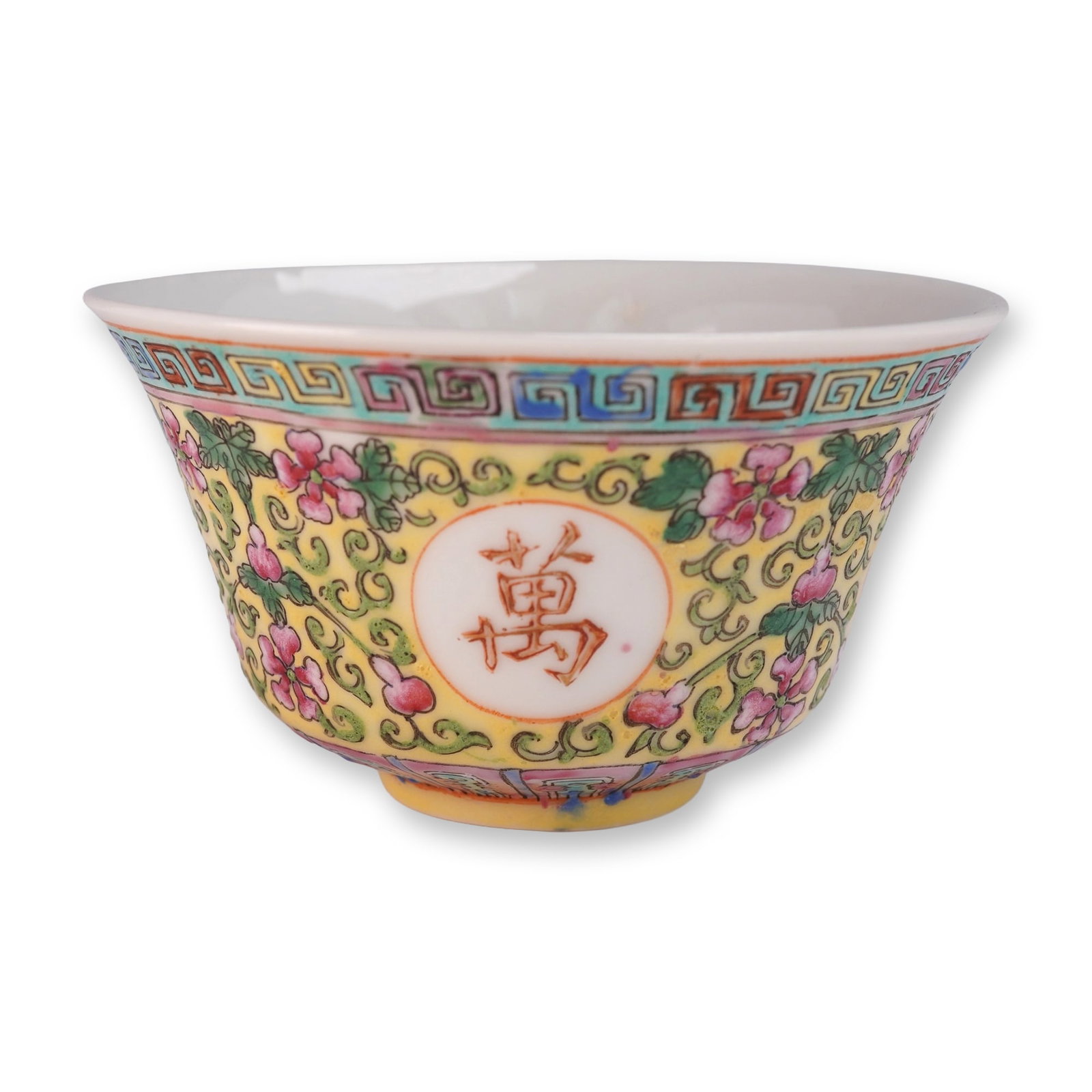 Chinese Yellow Famille Rose Porcelain Tea Bowl: Featuring finely hand-painted floral motifs in vibrant pink and green on a rich yellow ground. The exterior is decorated with alternating roundels containing auspicious characters in iron-red enamel a