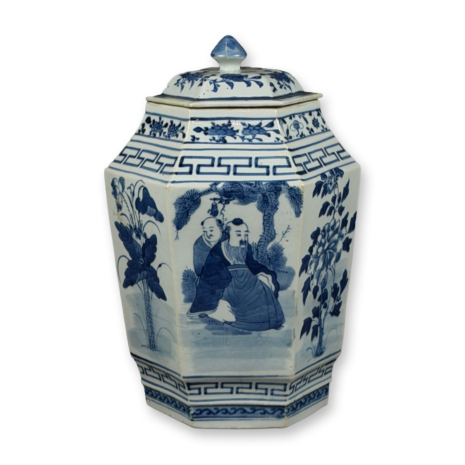 Qing Dynasty Hexagonal Blue and White Glazed Porcelain Lidded Jar: This Chinese hexagonal lidded porcelain jar features alternating panels decorated in underglaze blue depicting figures in a landscape, including scholars under a pine tree, and various botanical motif
