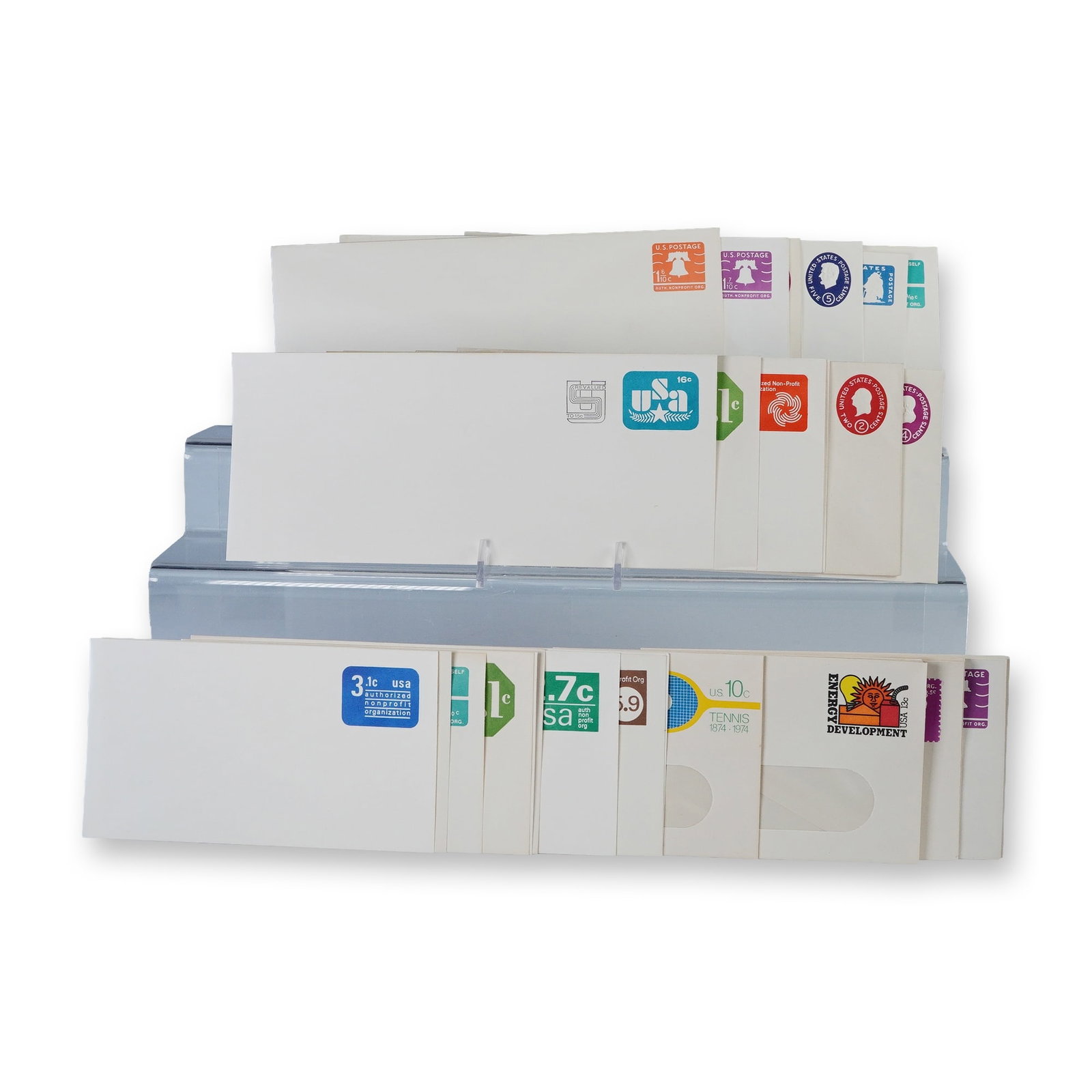 30pc Vintage US Postal Stationery Envelopes: Collection of thirty vintage United States postal stationery envelopes with pre-printed postage in assorted denominations and designs. Includes colorful examples featuring motifs such as the Liberty