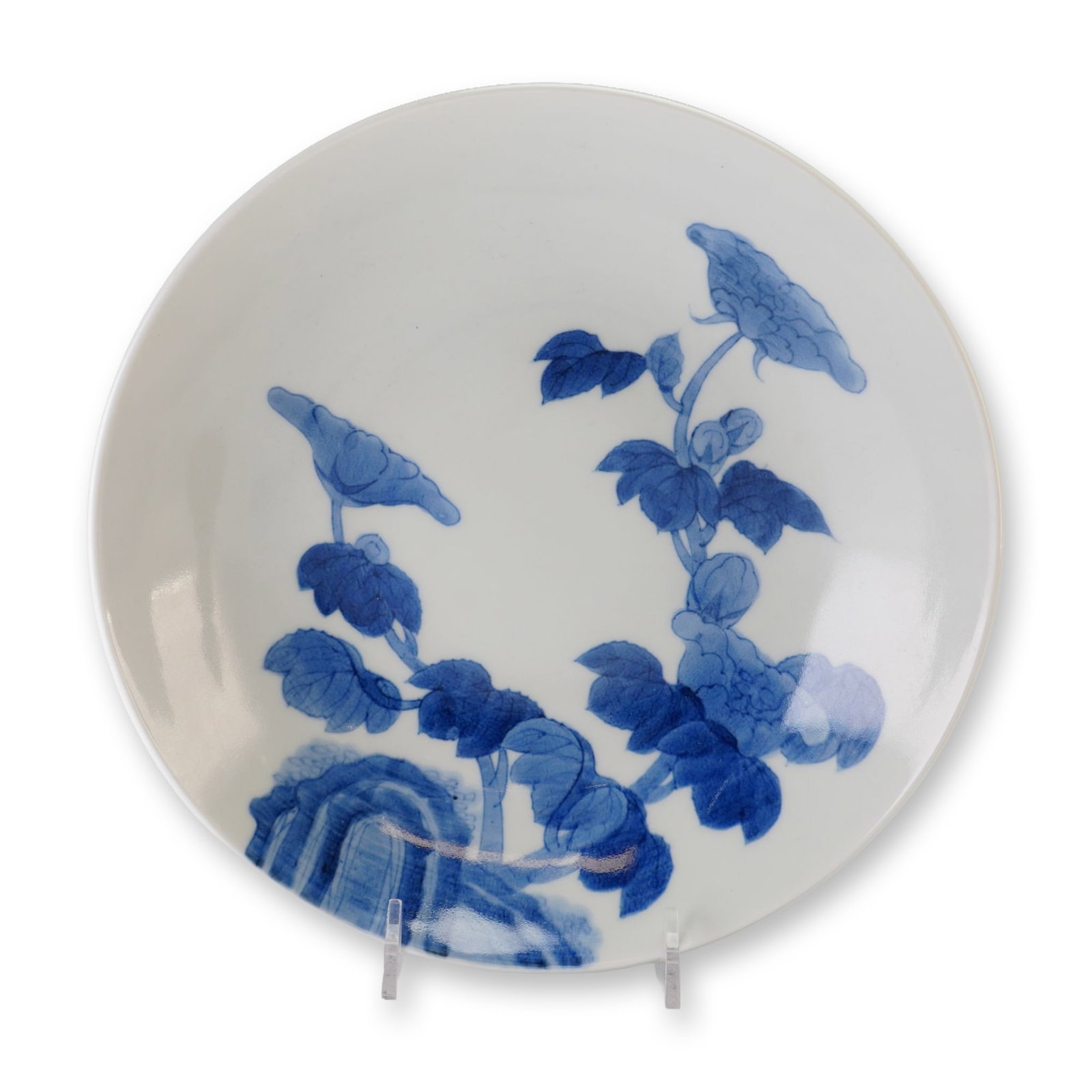 Japanese Nabeshima Blue and White Porcelain Dish, Flowers and Coins Designs: A Japanese Nabeshima blue and white porcelain bowl featuring blooming floral decorations on the interior and coin motifs on the exterior. Dimensions: 2"H x 8.25" dia. Weight: 1.6 lb