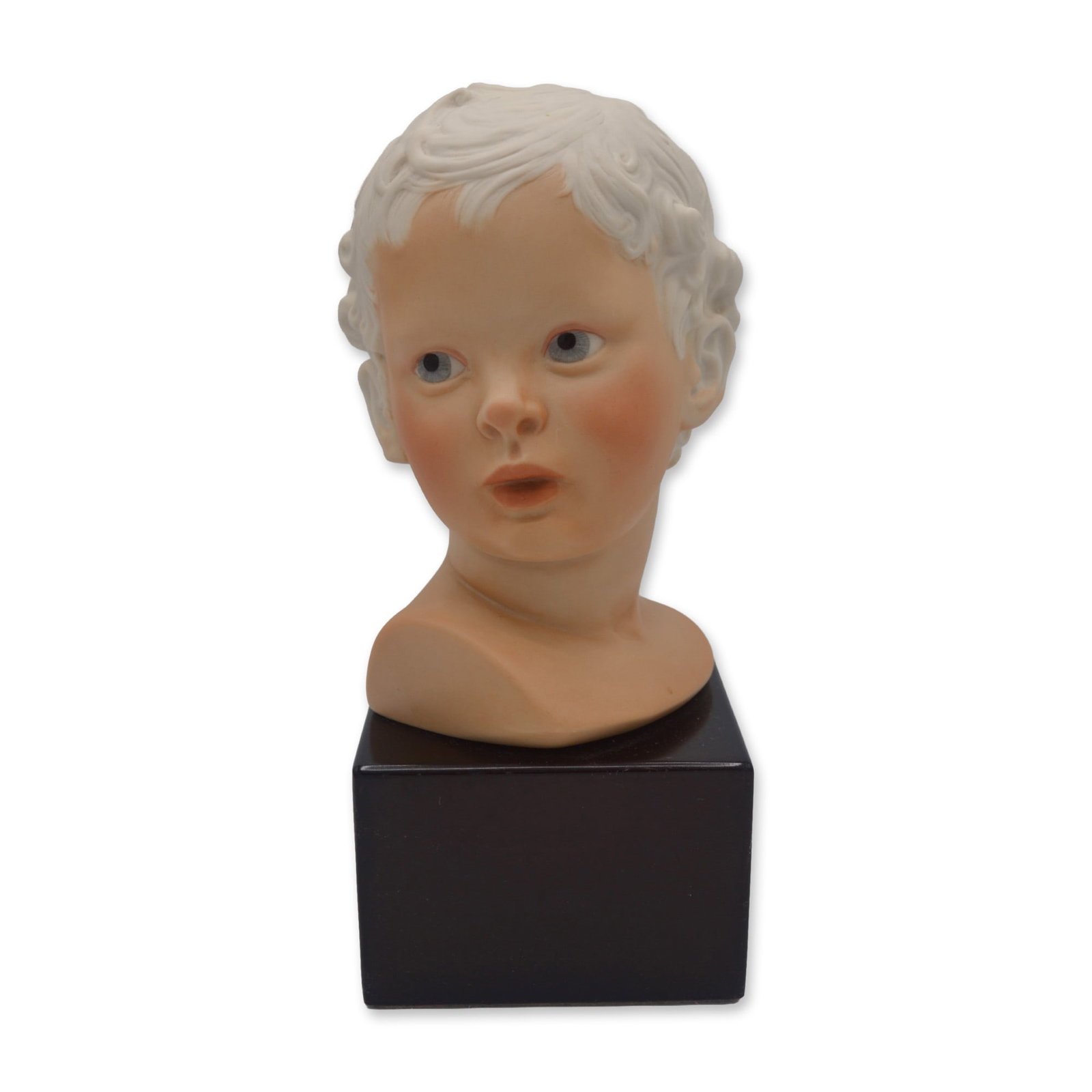 Cybis Porcelain Eros Child Bust On Wood Base, 1974: Bisque Porcelain Decorated, hand created, hand painted by the Artisans of the Cybis Studios in Trenton, NJ, USA. Featuring the Sculpture of Eros, The Child Head Bust on a Wood Base from The Fantasia C