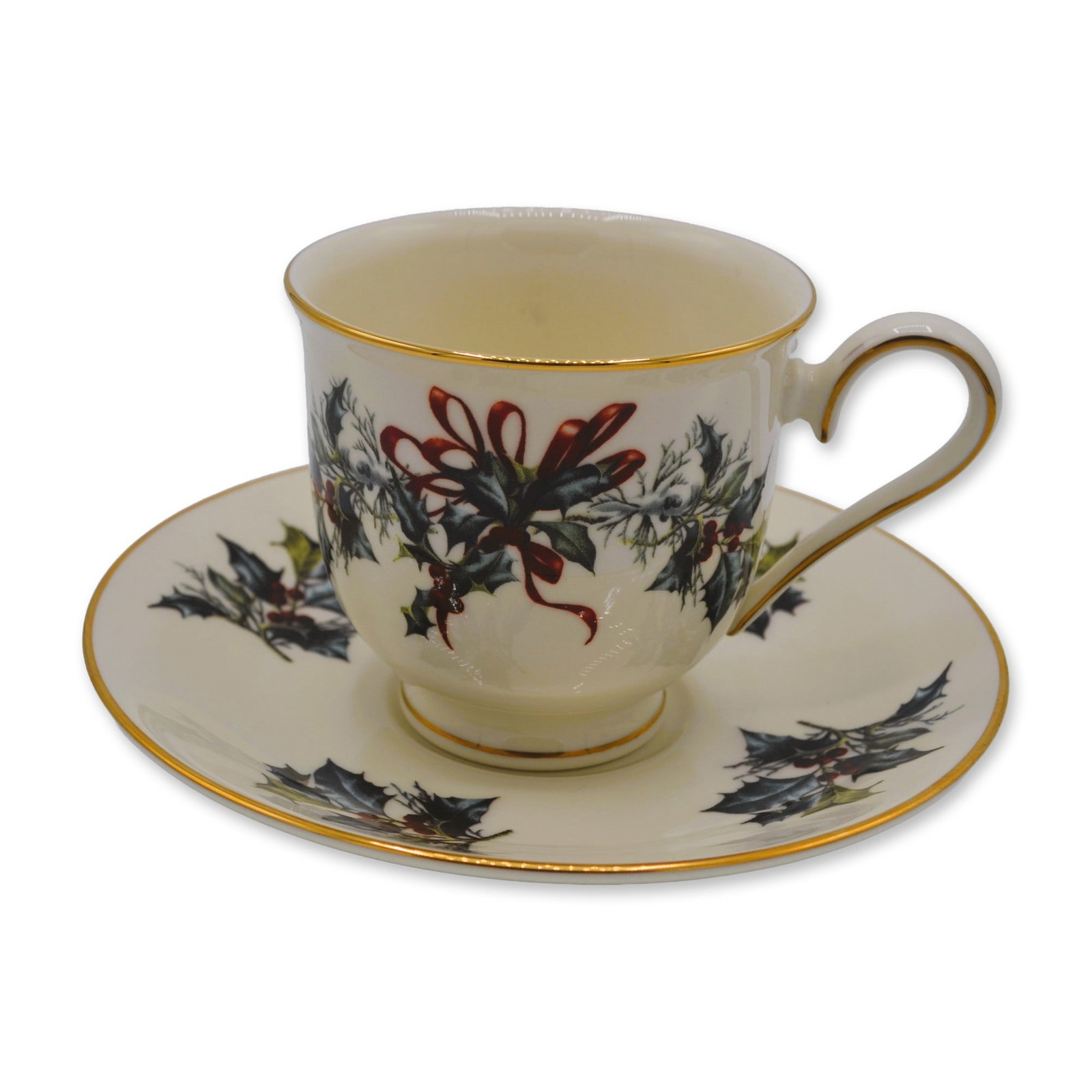 2Pc Lenox China Winter Greetings Footed Cup and Saucer Set, 1995: Lenox Winter Greetings Footed Cup and Saucer Set is a holiday delight, featured in Fine Ivory China. The beautiful pattern features a variety of wintertime backyard birds - the nuthatch, chickadee, an