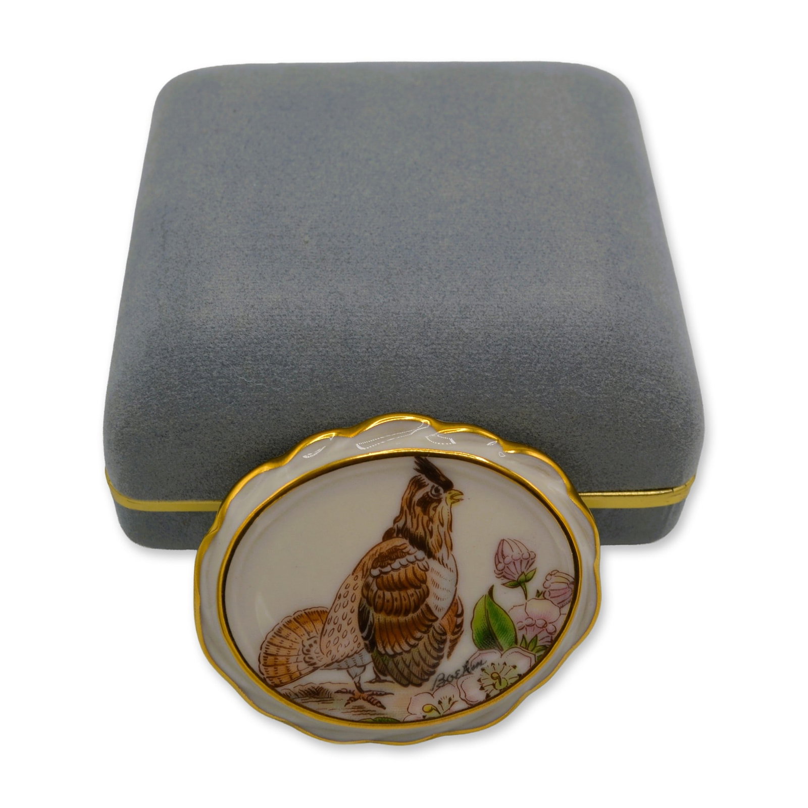 Boehm Porcelain Ruffed Grouse Pendant Pin, BJ-08 W/Box, 1980: Glazed Porcelain Decorated, this Pin/Pendant is hand painted, hand created by the Artists of the Boehm Studio portraying the Ruffed Grouse, Standing. It is featured on an ivory background with applied