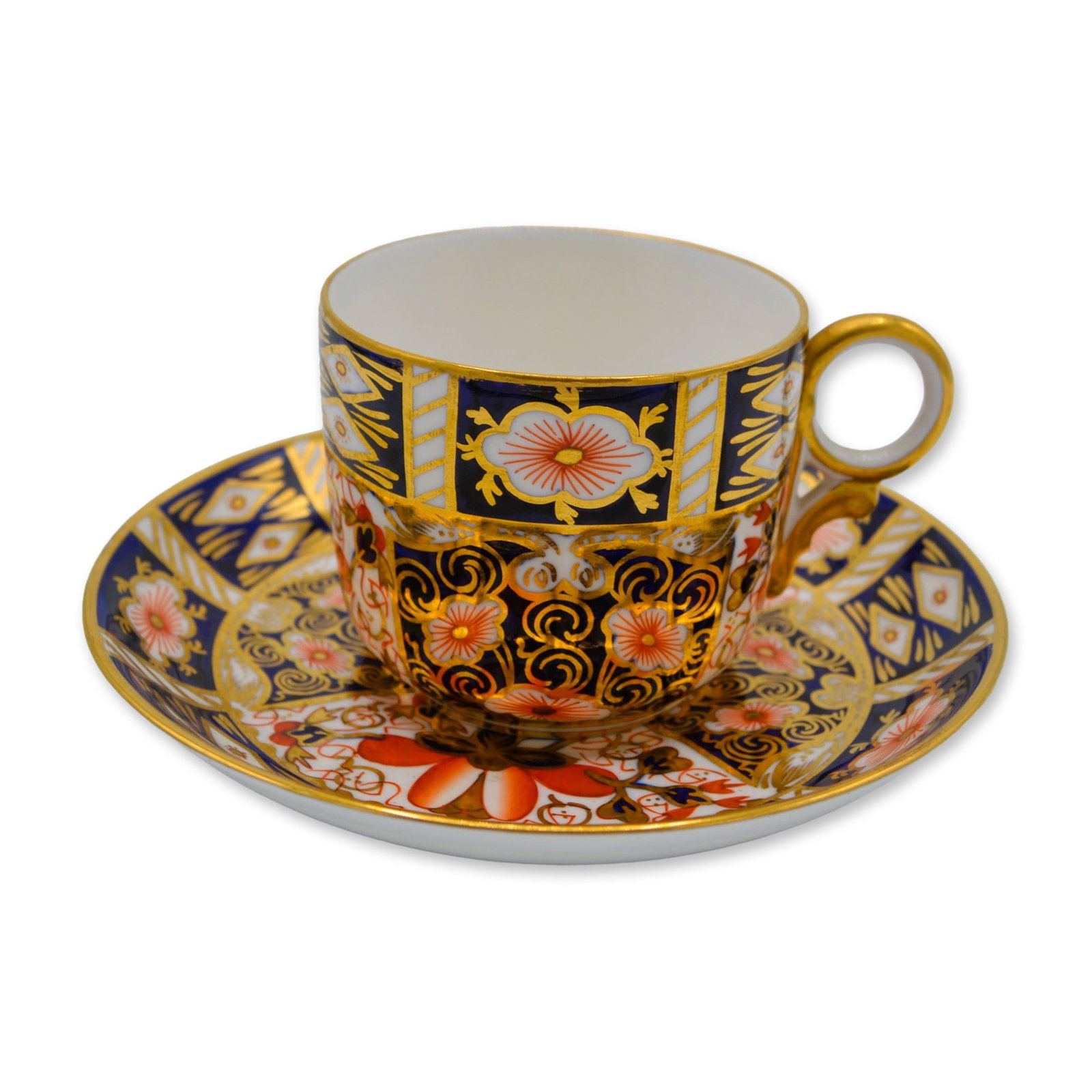 2Pc Royal Crown Derby Porcelain Old Imari Footed Cup and Saucer Set, 22K Gold, 1960: 2Pc Royal Crown Derby Old Imari Footed Cup and Saucer Set, 22K Gold, Fine Bone China. An exquisite Royal Crown Derby Old Imari Footed Cup and Saucer hand crafted in England by the Artisans of the Roya