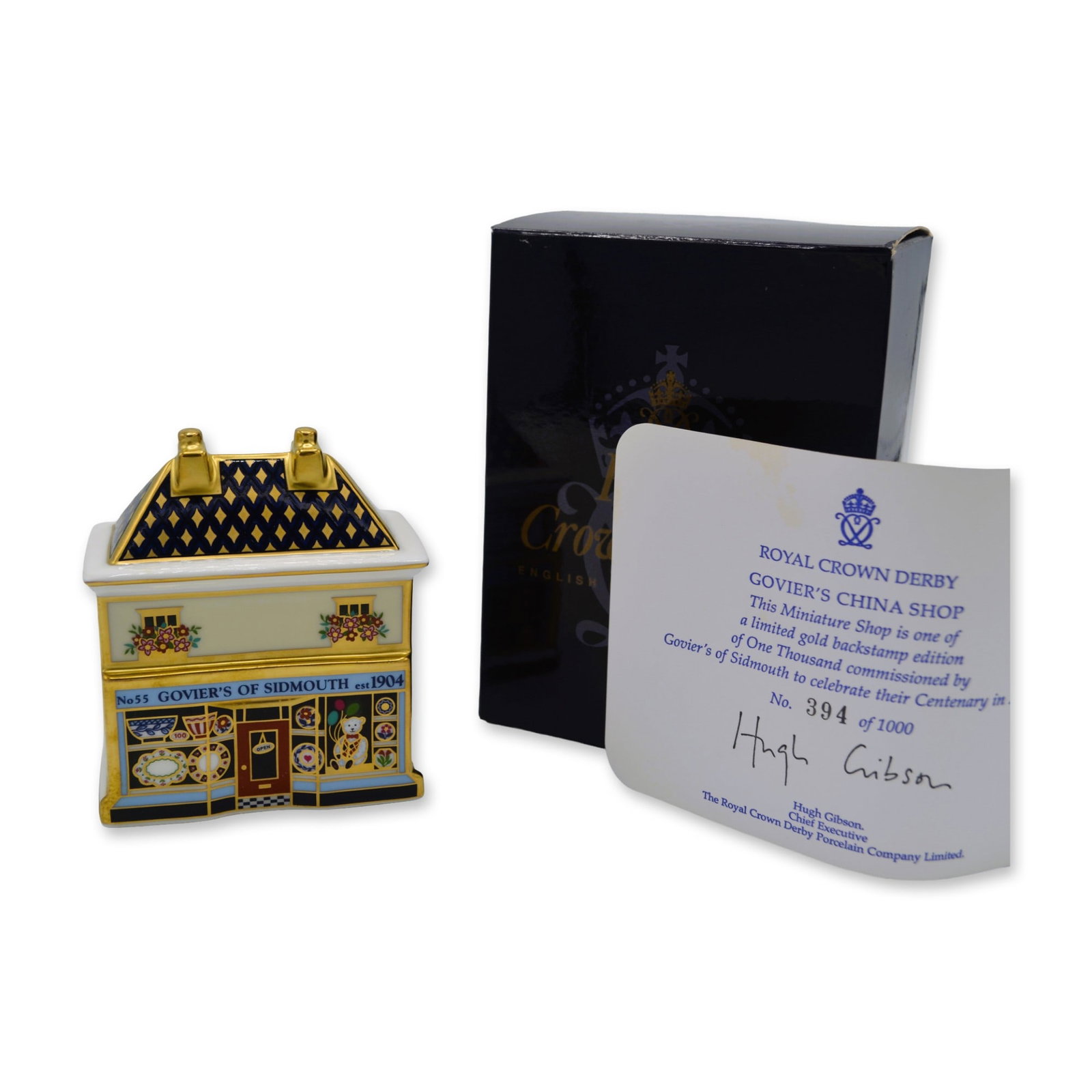 Royal Crown Derby Porcelain LE Govier's China Shop Paperweight, Gold Edition, COA, OB, 2004: Royal Crown Derby Porcelain LE Govier's China Shop Paperweight, Gold Edition. This Miniature Shop is one of a Limited Gold Backstamp Edition of One Thousand (1000) commissioned by Govier's of Sidmouth