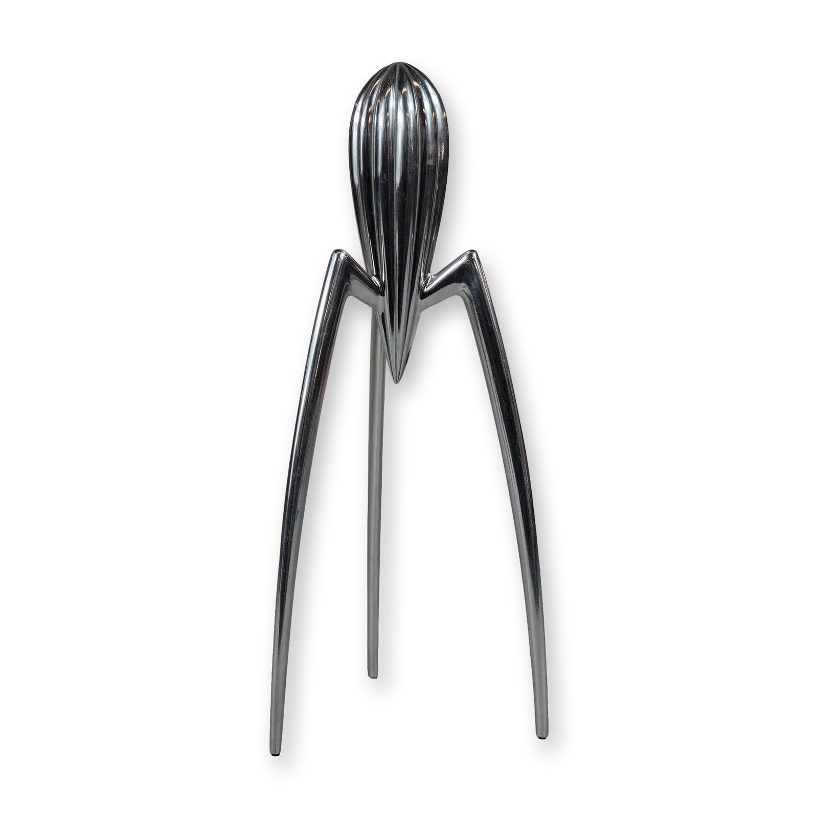 Philippe Starck Alessi Aluminum Citrus Squeezer: Philippe Starck (French, b. 1949) for Alessi. Polished cast aluminum citrus squeezer and reamer in the "Juicy Salif" pattern. The sculptural design features a central, teardrop-shaped body with vertic