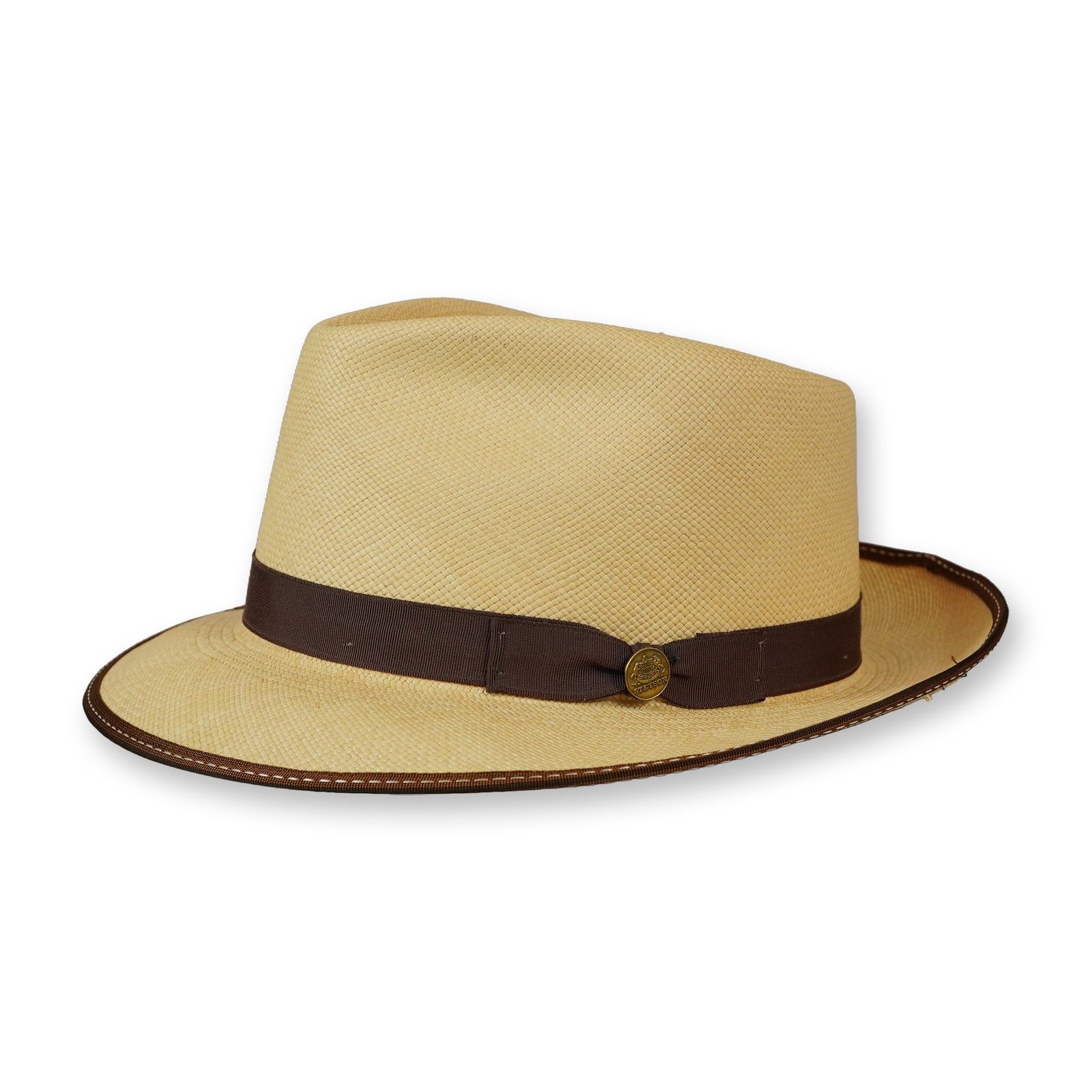 Stetson Hand-Woven Panama Straw Fedora: Stetson Panama-style fedora hand-woven in Ecuador. Fedora in natural cream straw featuring a center dent crown, dark brown grosgrain ribbon band with a signature gold-tone Stetson pin, and a brown bou