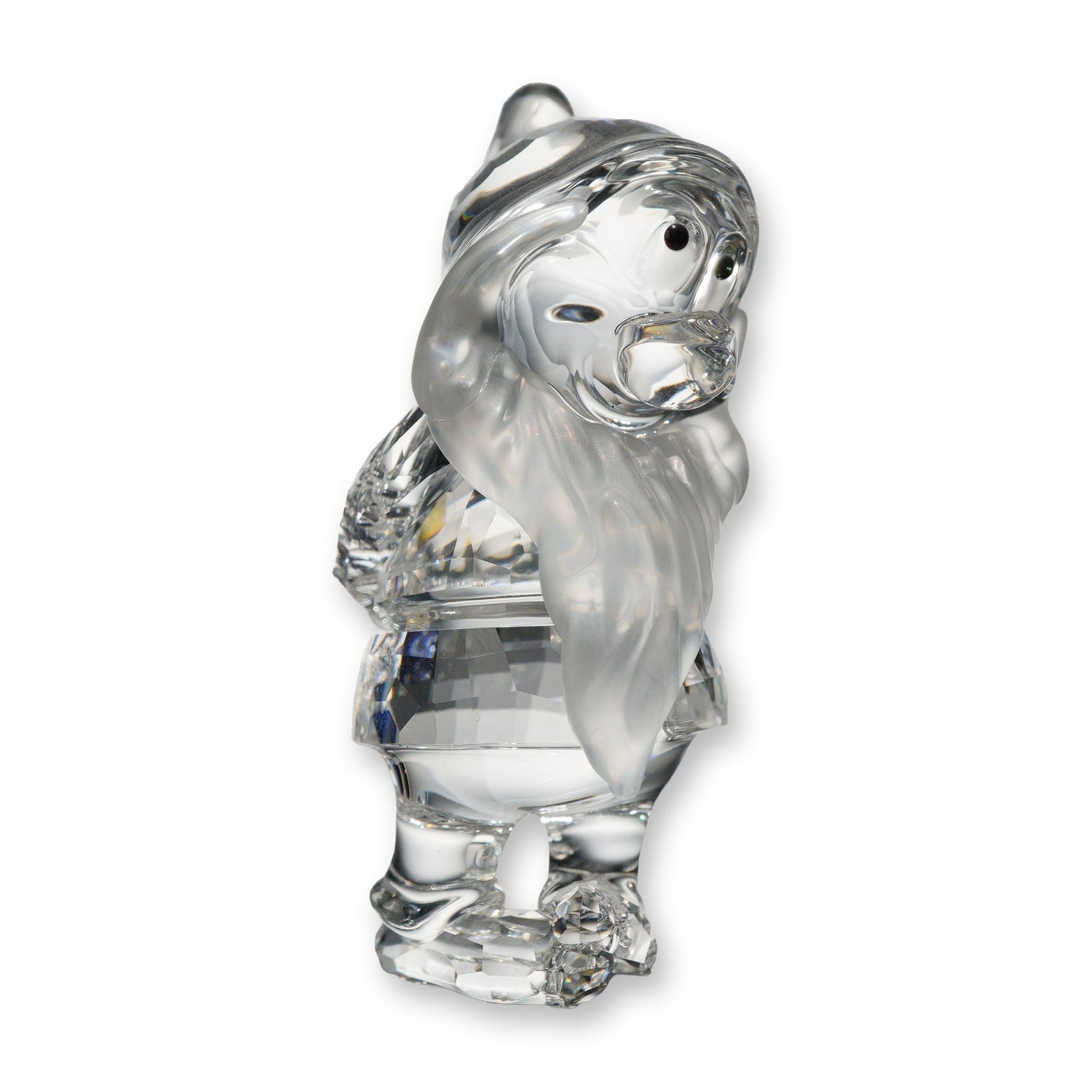 Swarovski Disney Crystal Bashful Dwarf Figurine: Swarovski crystal figurine depicting the character Bashful from the Walt Disney film Snow White and the Seven Dwarfs. The piece features a faceted clear crystal body with a frosted crystal beard and h
