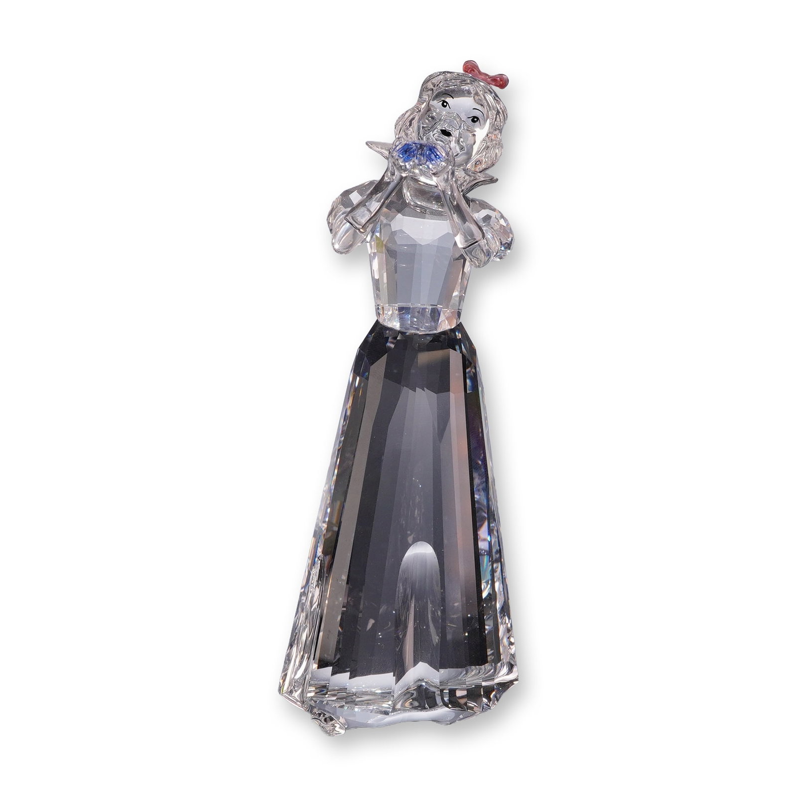 Swarovski Crystal 2019 Disney Figurine, Snow White: The faceted clear crystal figure depicts the character holding a light blue crystal bird, with an applied red crystal bow in her hair and painted facial features. Marked with the acid-etched Swarovski