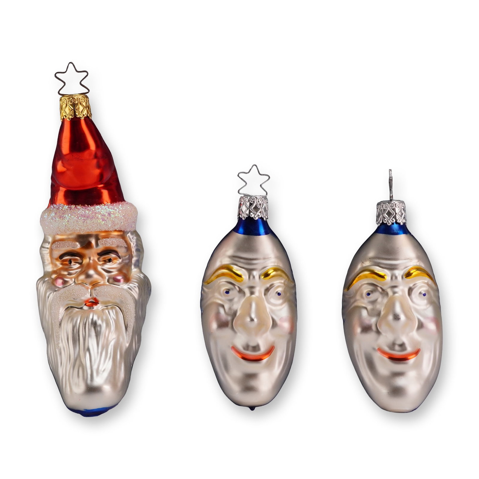 3pc Inge-Glas Moon and Star Themed Glass Ornaments: Hand-blown glass figural Christmas ornaments by Inge-Glas, including one Santa Claus head and two celestial face designs in the Radko style. Each ornament is crafted with a silvered interior and finis