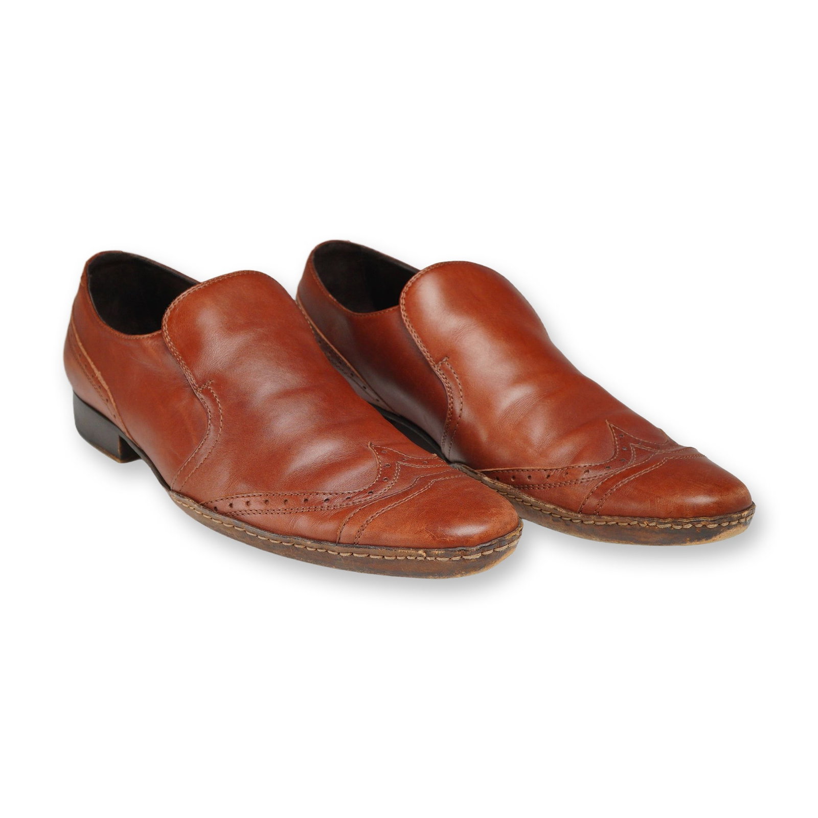 D&G Dolce and Gabbana Leather Wingtip Slip On Loafers: D&G Dolce and Gabbana leather wingtip slip-on loafers, made in Italy. This pair of shoes features cognac brown leather uppers with wingtip brogue detailing and stitched accents. The interior is lined 
