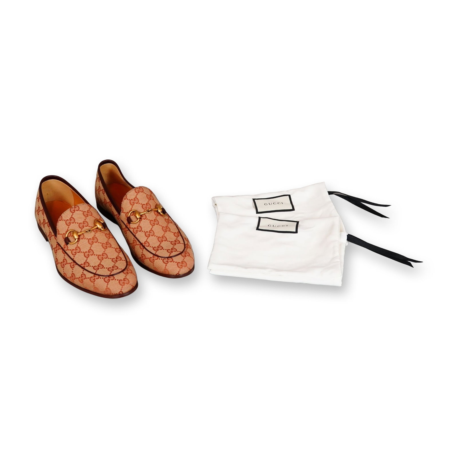 Gucci Jordaan GG Canvas Horsebit Loafers: Gucci Jordaan Literature and Art casual flat loafers in beige and brown GG monogram canvas with dark brown leather trim. Features gold-toned metal horsebit hardware details, tan leather soles, and lea