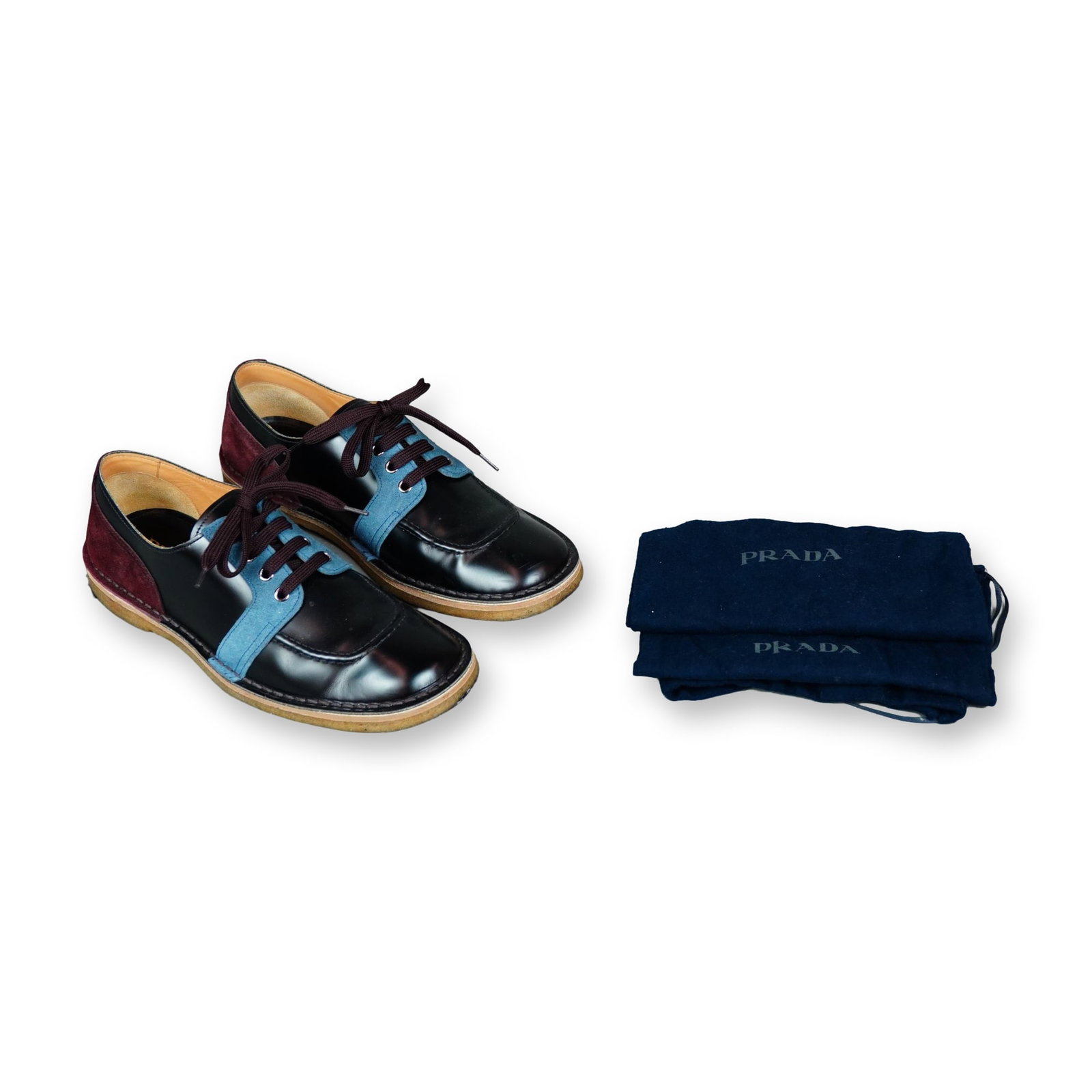 Prada Colorblock Crepe Sole Derby Shoes: Prada colorblock lace-up dress shoes, style 2EG225, from a discontinued archive line. The uppers are constructed in polished black leather with blue suede lace guards and burgundy suede heel panels. F