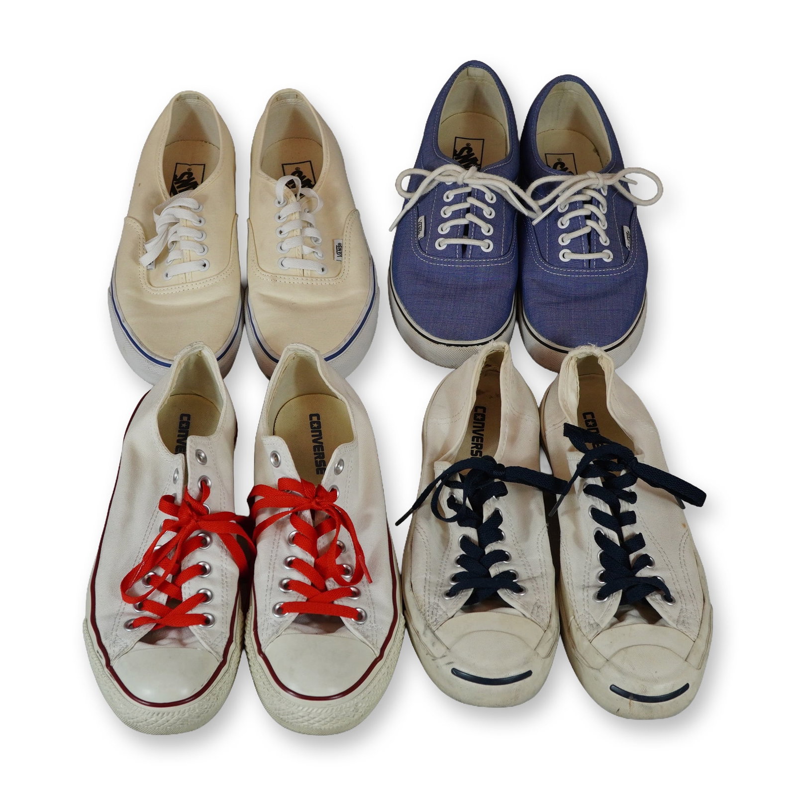 Four Pairs of Vans and Converse Canvas Sneakers: Collection of four pairs of low-top canvas sneakers by Vans and Converse. The group includes two pairs of Vans Authentic sneakers in off-white and blue canvas with white laces and signature waffle-pat