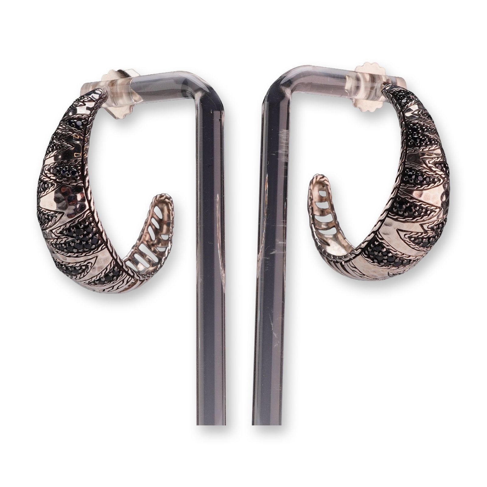 Pair of John Hardy Sterling Silver and Black Sapphire Tapered Hoop Earrings: A matched pair of John Hardy tapered C-hoop earrings crafted from sterling silver and set with black sapphires. Each earring features multiple rows of small, round-cut black sapphires in pave settings