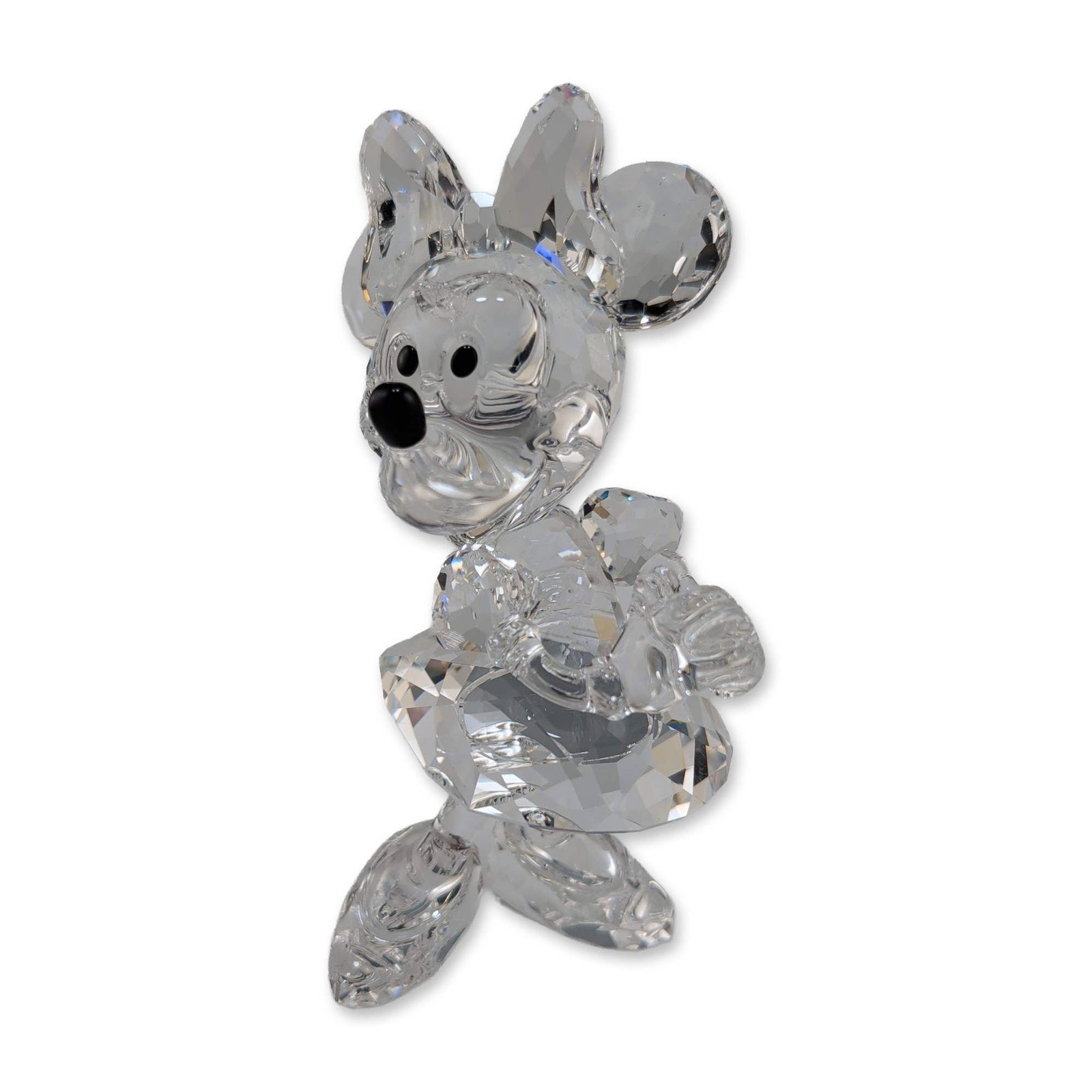 Swarovski Disney Collection Crystal Minnie Mouse Figurine: Swarovski Minnie Mouse figurine in faceted clear lead crystal, from the Disney Showcase collection. The character is depicted in a dynamic pose wearing a faceted bow and skirt, accented with black cry