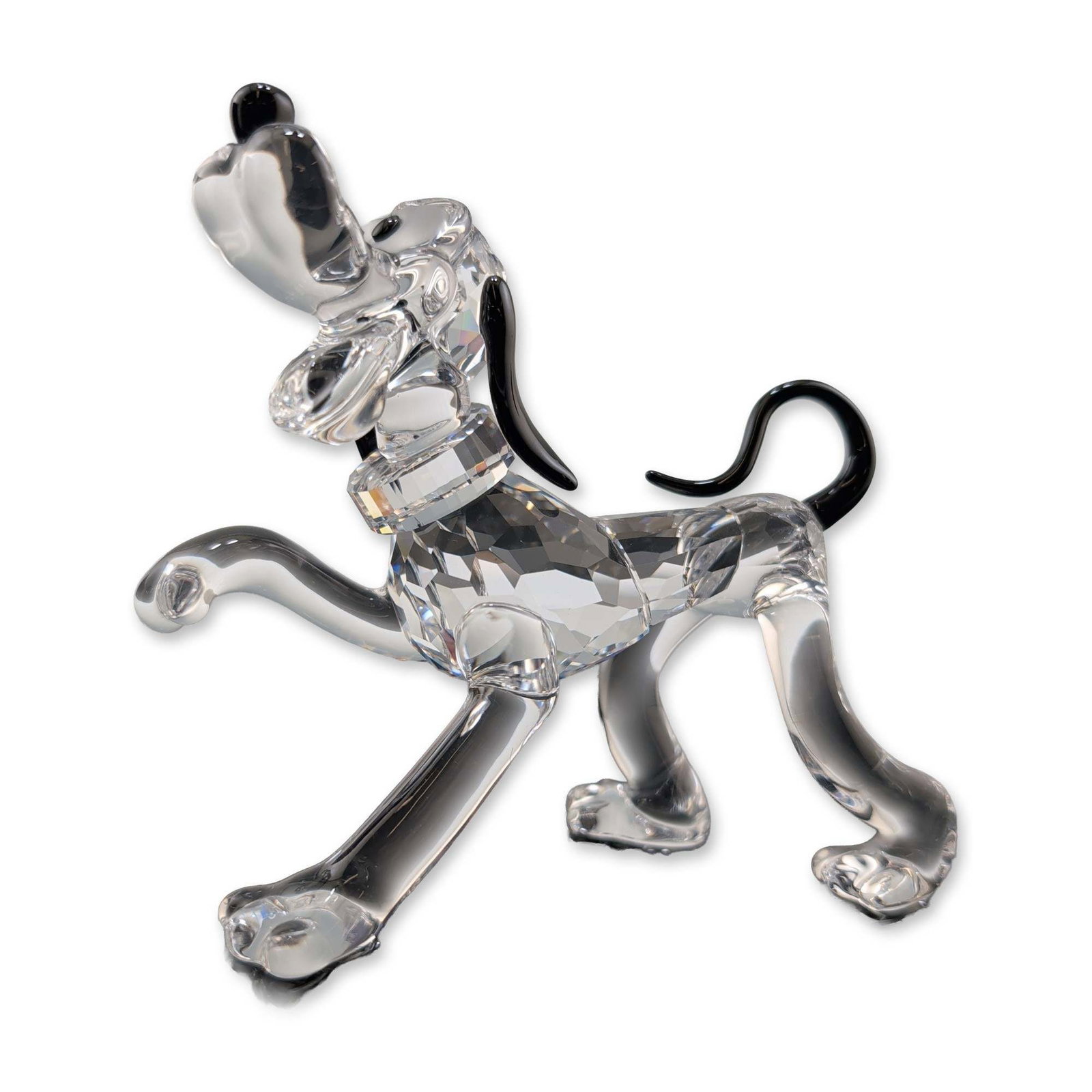 Swarovski Disney Showcase Crystal Figurine, Pluto: Swarovski Disney collection Pluto figurine in faceted and molded lead crystal, depicting the character in a playful welcoming pose. The figure features a faceted clear crystal body, head, and collar, 