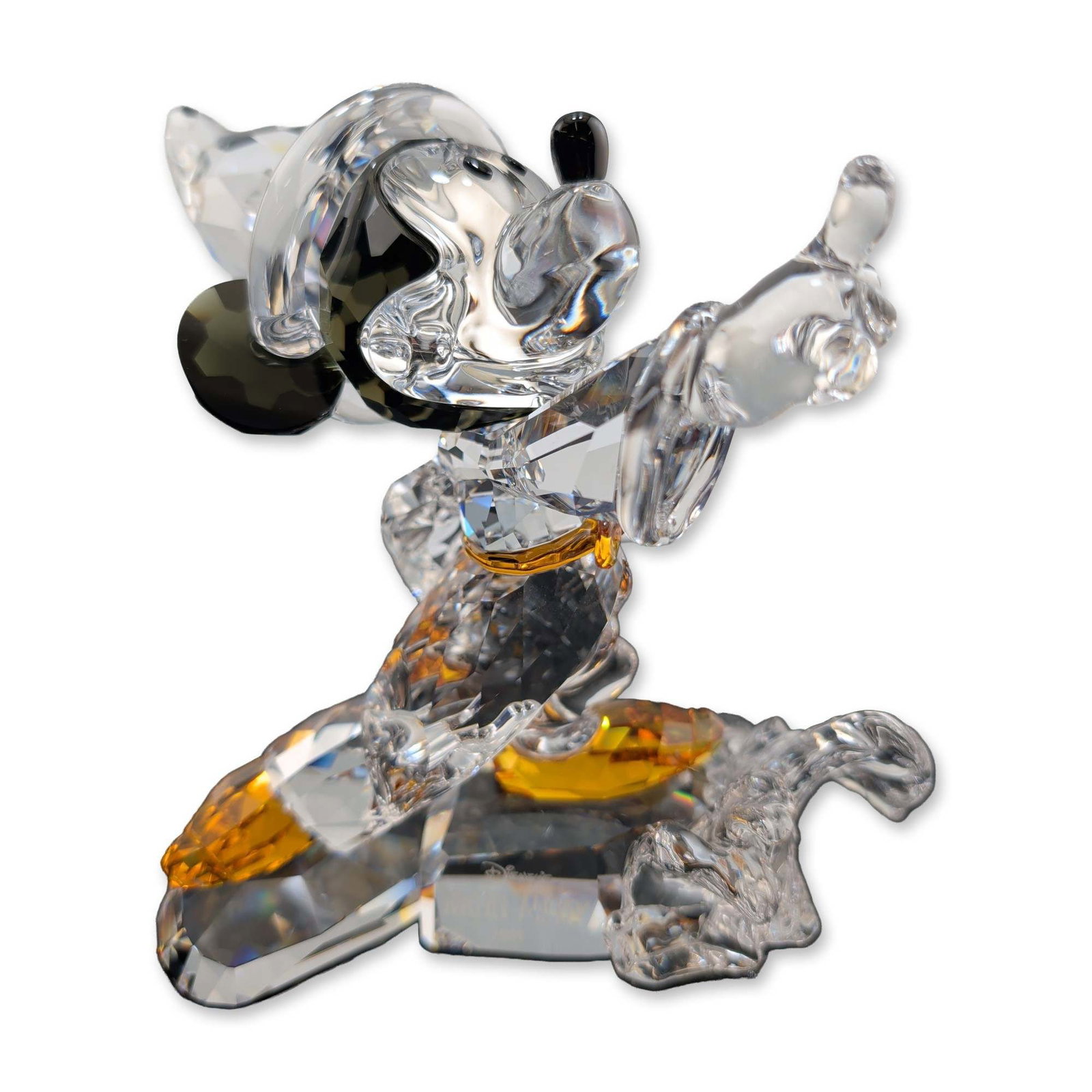 Swarovski Disney Crystal Figurine, Sorcerer Mickey 2009: Swarovski Disney limited edition figurine of Mickey Mouse as the Sorcerer's Apprentice from the film Fantasia, released in 2009. The piece is constructed from multifaceted clear lead crystal with blac
