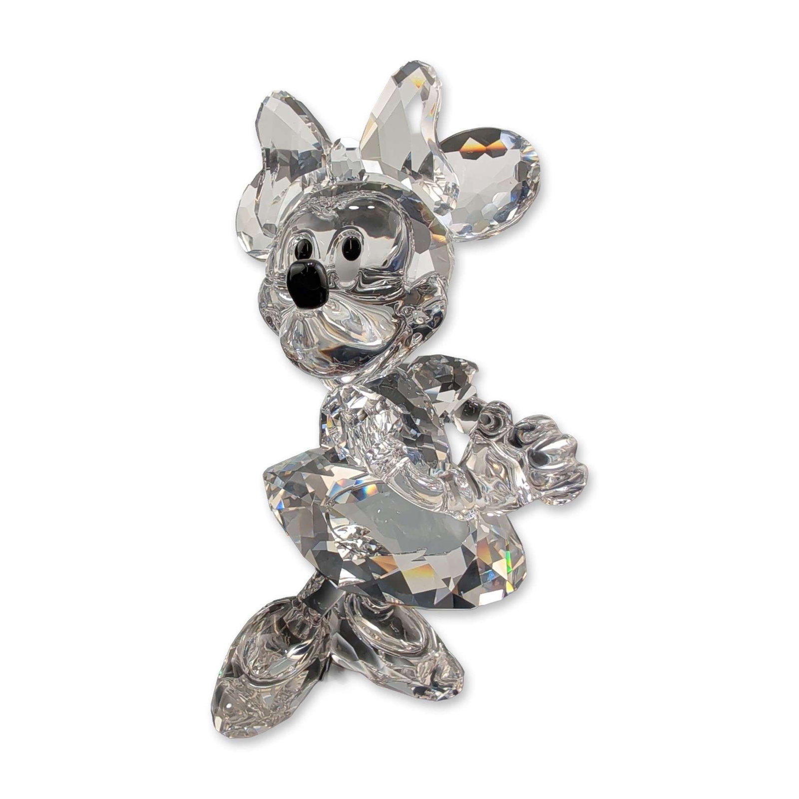 Swarovski Disney Showcase Crystal Figurine, Minnie Mouse: Swarovski Disney Showcase Collection Minnie Mouse figurine crafted in multi-faceted clear lead crystal. The figure is depicted in a dynamic pose wearing a bow and skirt, featuring Jet crystal accents 