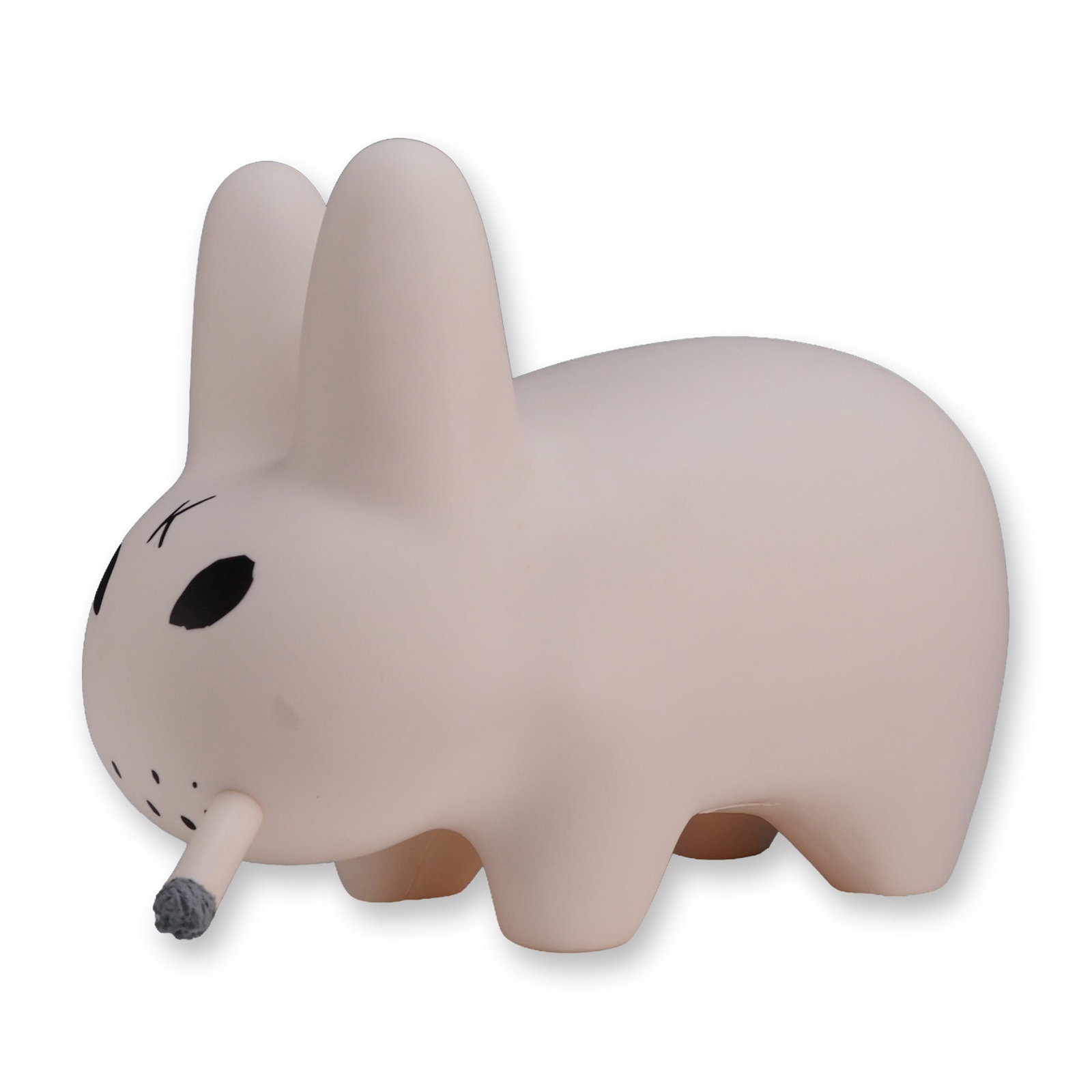 Kidrobot Frank Kozik Smorkin' Labbit Figure: Designer art toy in matte white vinyl, featuring minimalist black painted details including almond-shaped eyes, a K on the forehead, snout markings, and a tail dot. A molded cigarette accessory with a