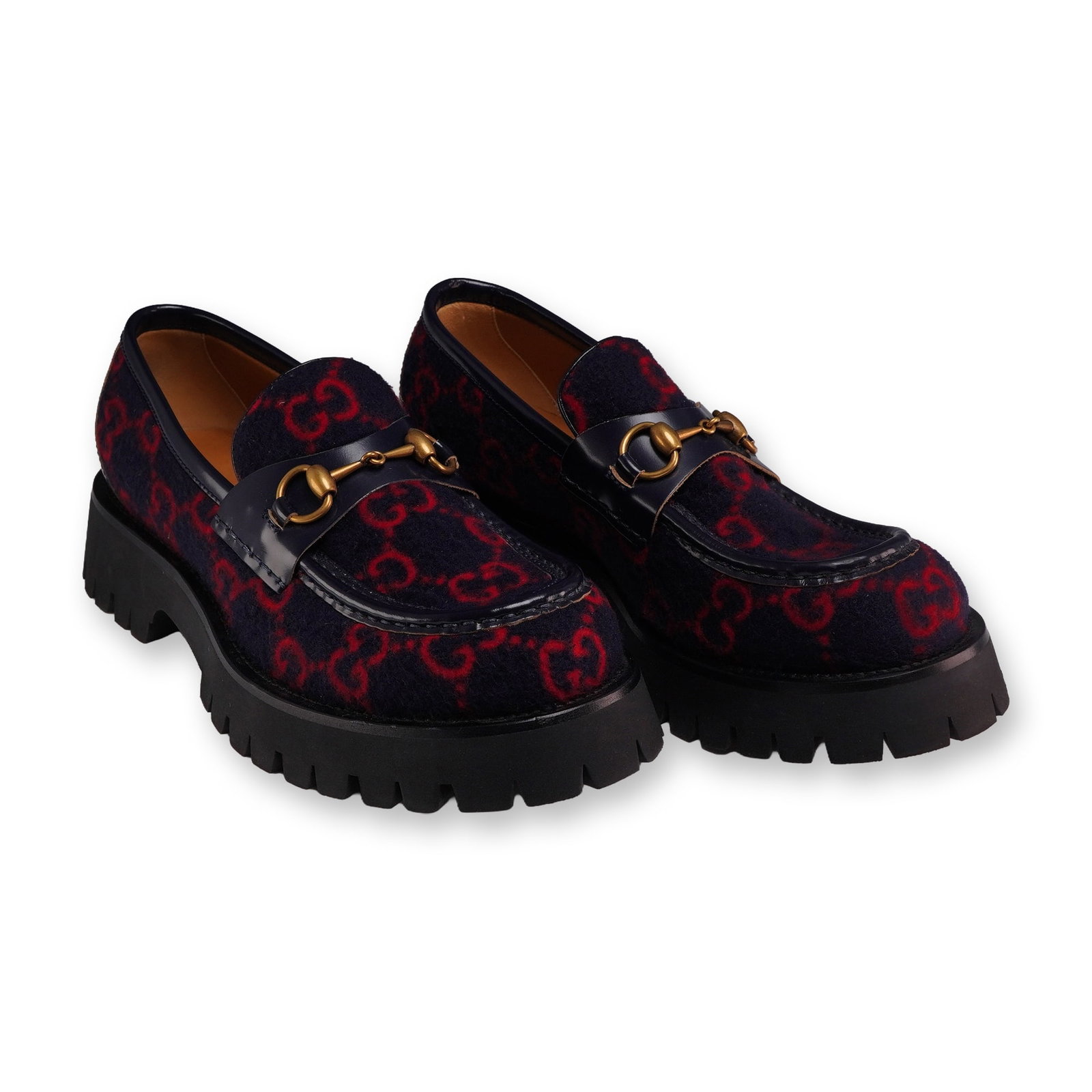 Gucci GG Monogram Wool Horsebit Loafers: Gucci. Pair of men's size 8 horsebit loafers featuring navy blue and red GG Supreme monogram wool uppers with dark navy leather trim. Design incorporates a signature gold-tone metal horsebit across th
